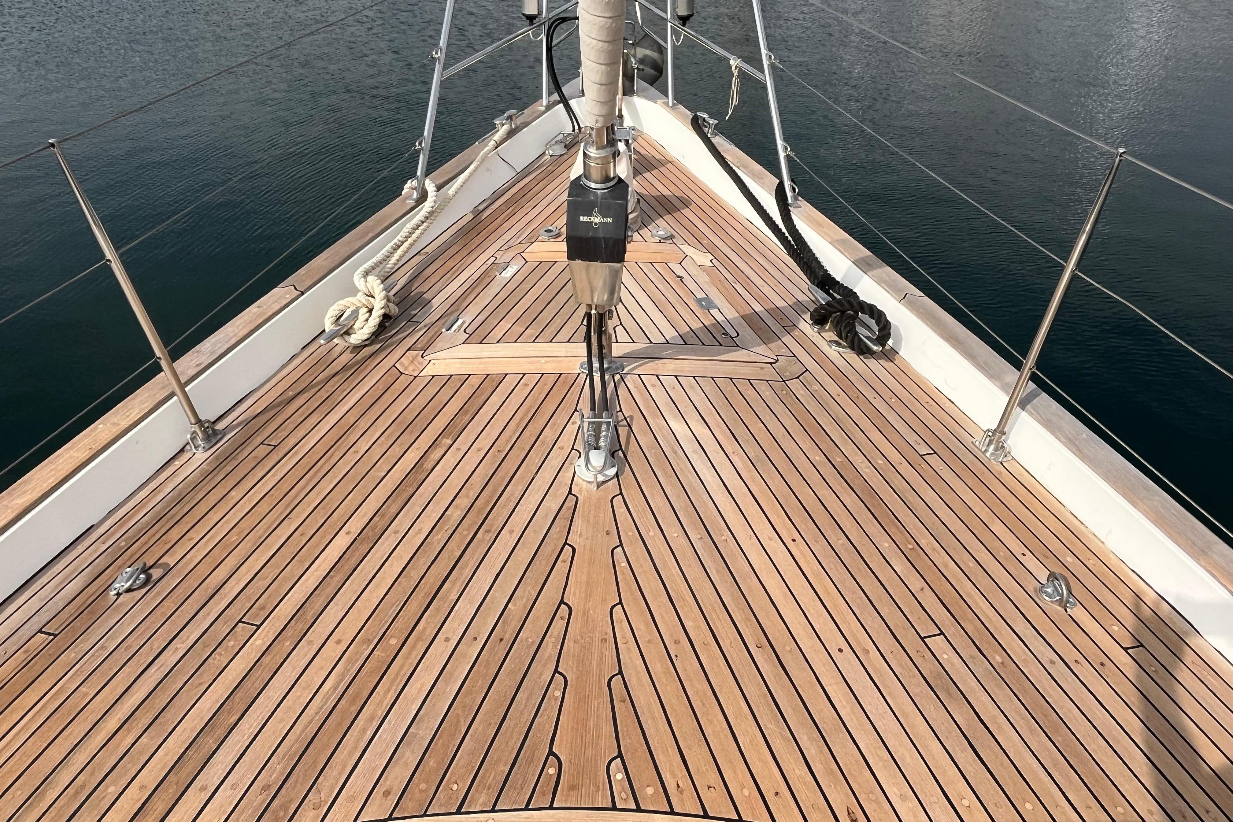 Deck of 2001 Contest 55CS yacht with teak wood finish and rigging details.