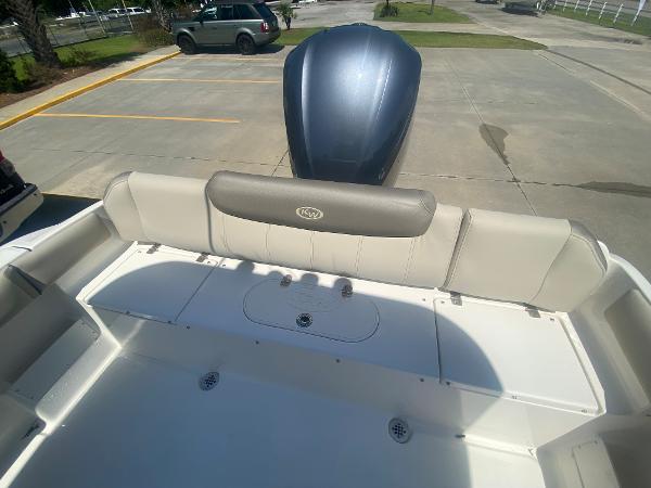 2024 Key West 239 FS boat with rear seating and outboard motor.