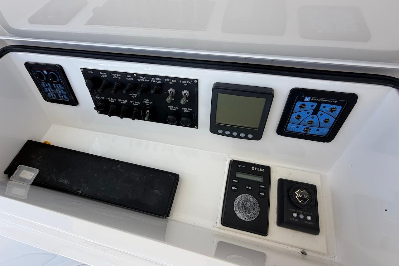 Control panel of a 2012 Viking 50 Convertible yacht with various switches and displays.