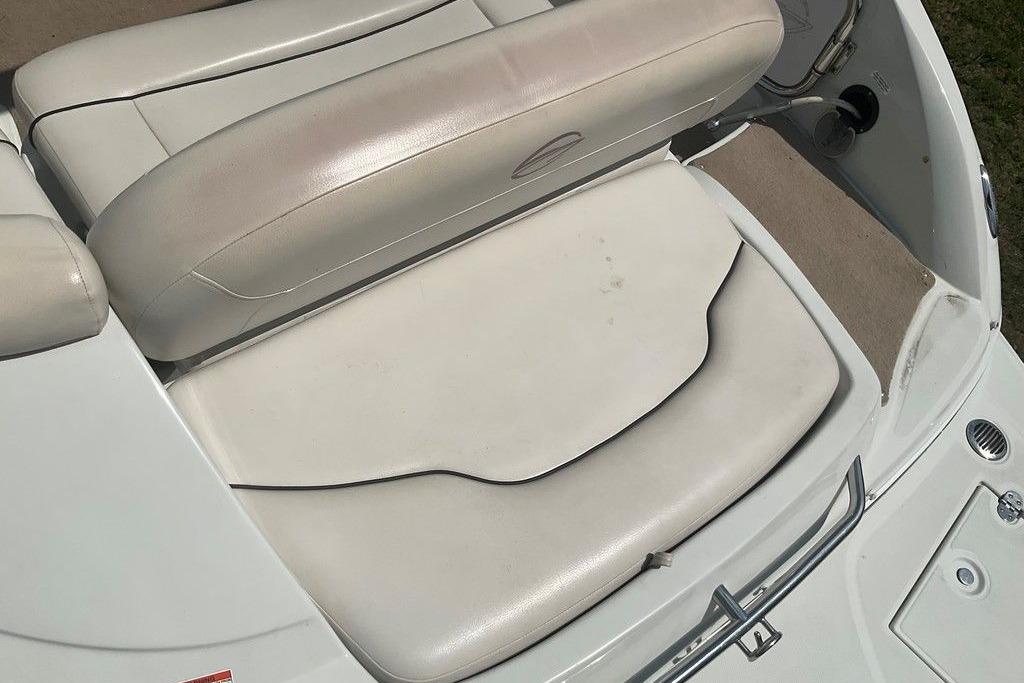 2015 Crownline 236 SC boat interior seating, featuring white cushioned seats.