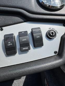 2025 Ranger RT198P control panel with switches and ignition.