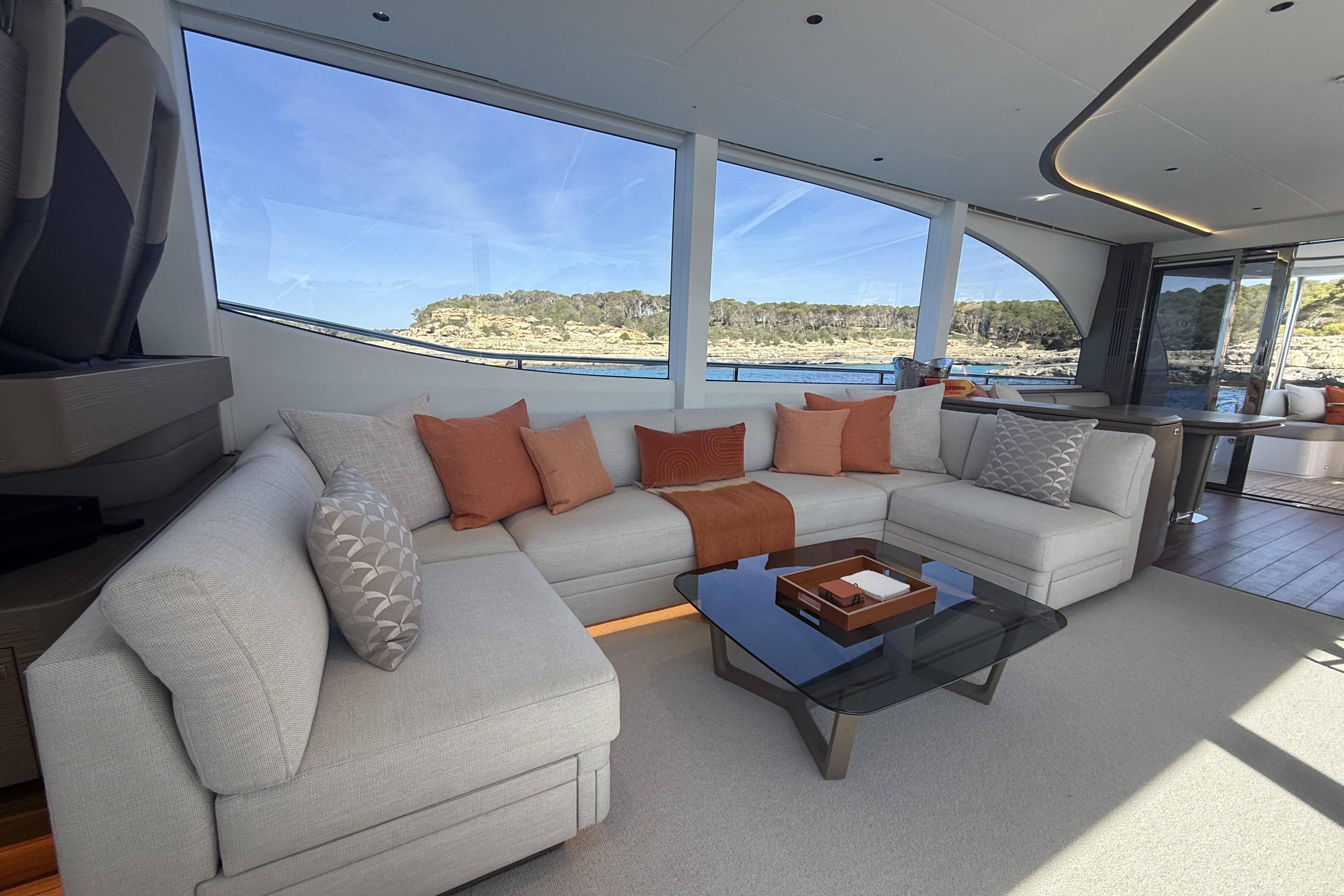 Luxurious interior of 2025 Princess Y72 yacht with elegant seating and scenic ocean view.