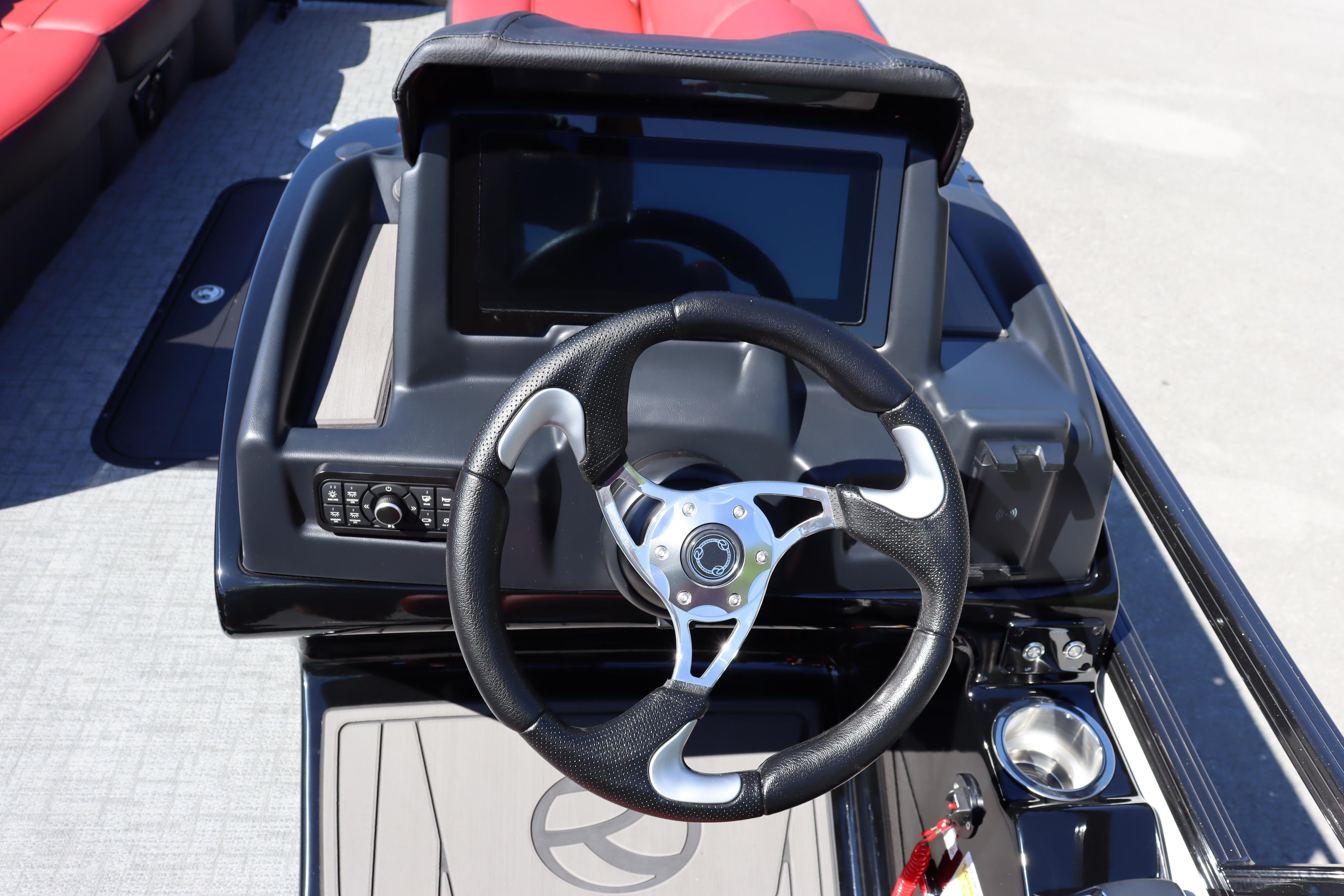 Steering console of 2026 Regency 250 DL boat with touchscreen and controls.