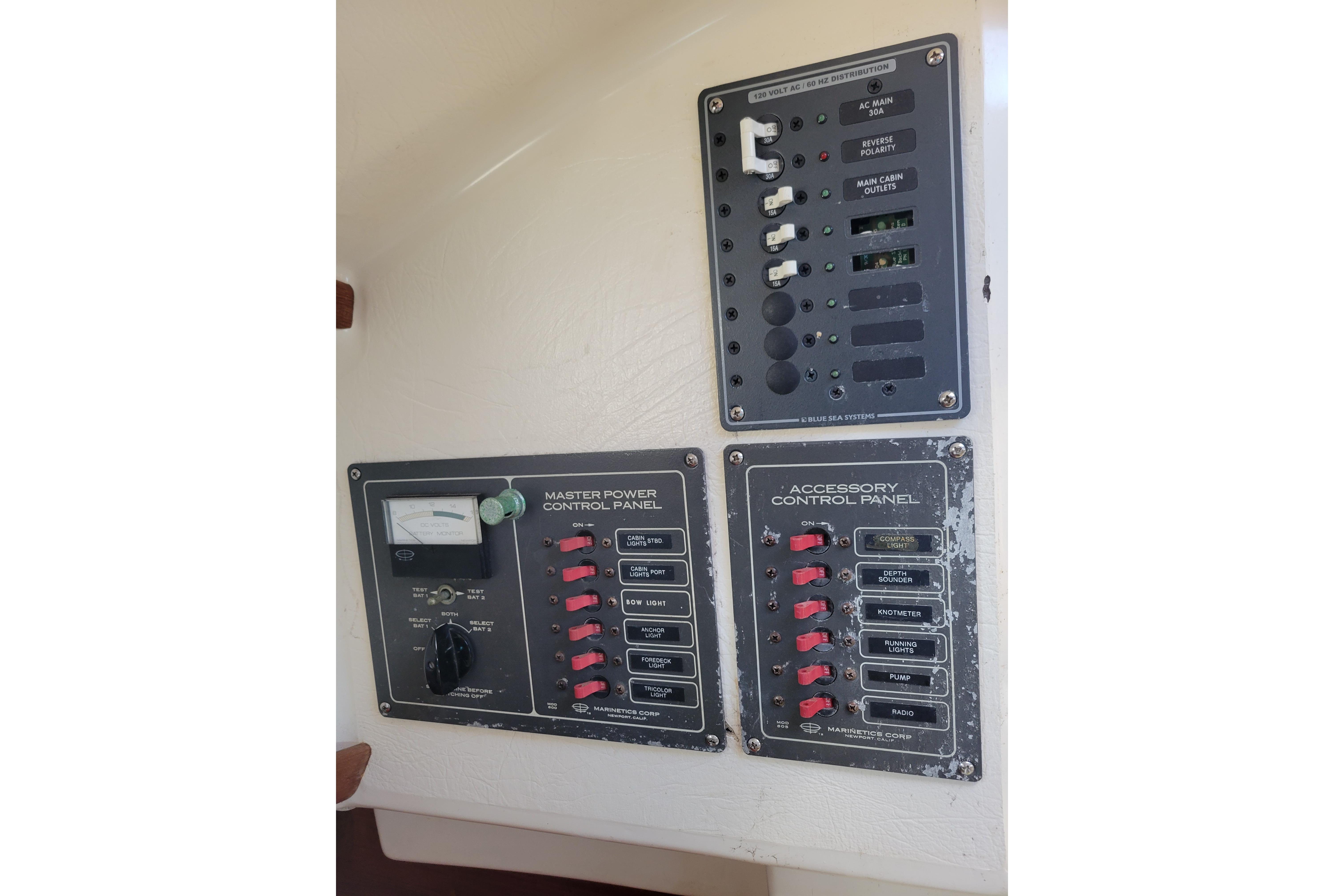 Electrical control panels on a 1981 Sea Sprite 34 boat, featuring switches and meters.