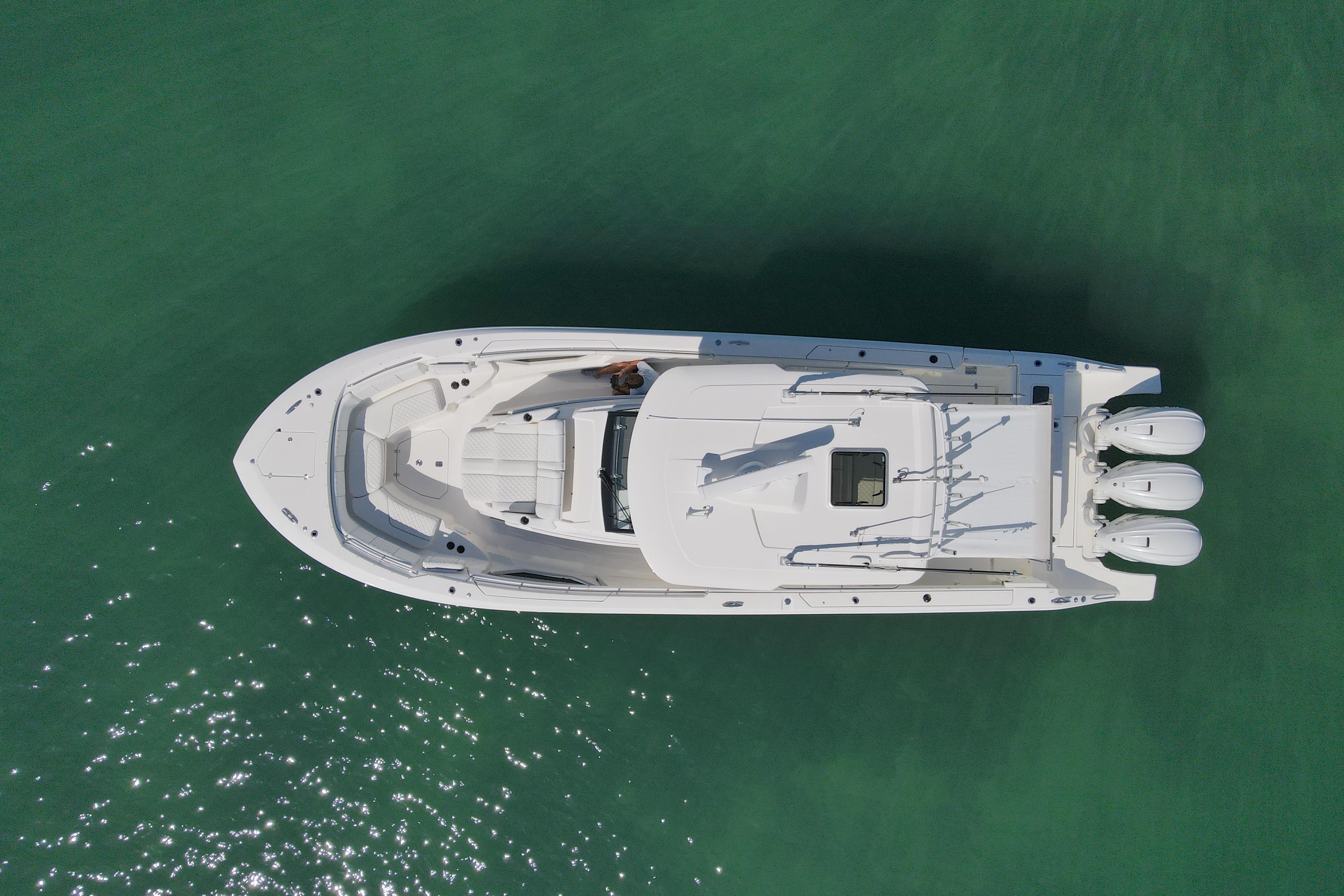 Overhead view of 2021 Pursuit S 378 Sport boat on clear water.