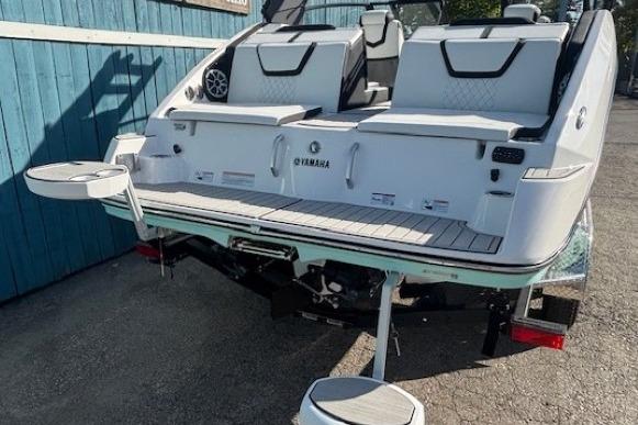2026 Yamaha Boats 222S with sleek design and modern seating, docked outdoors.