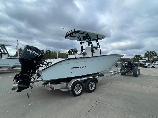 2026 Cape Horn 24XS boat on trailer with Suzuki outboard motor, parked outdoors.
