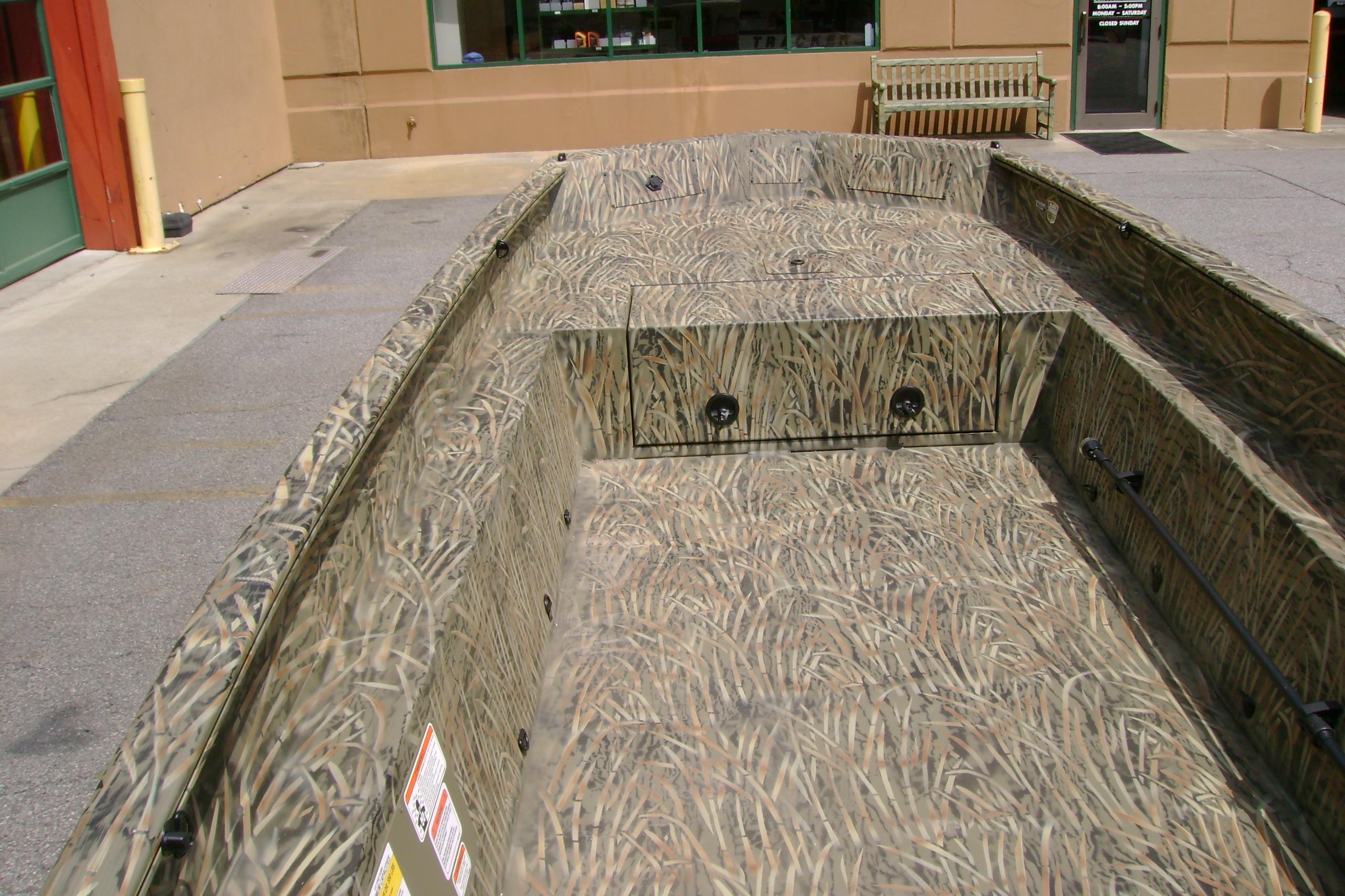 2026 Tracker Grizzly 1650 T Prairie Wings Edition boat with camouflage design.