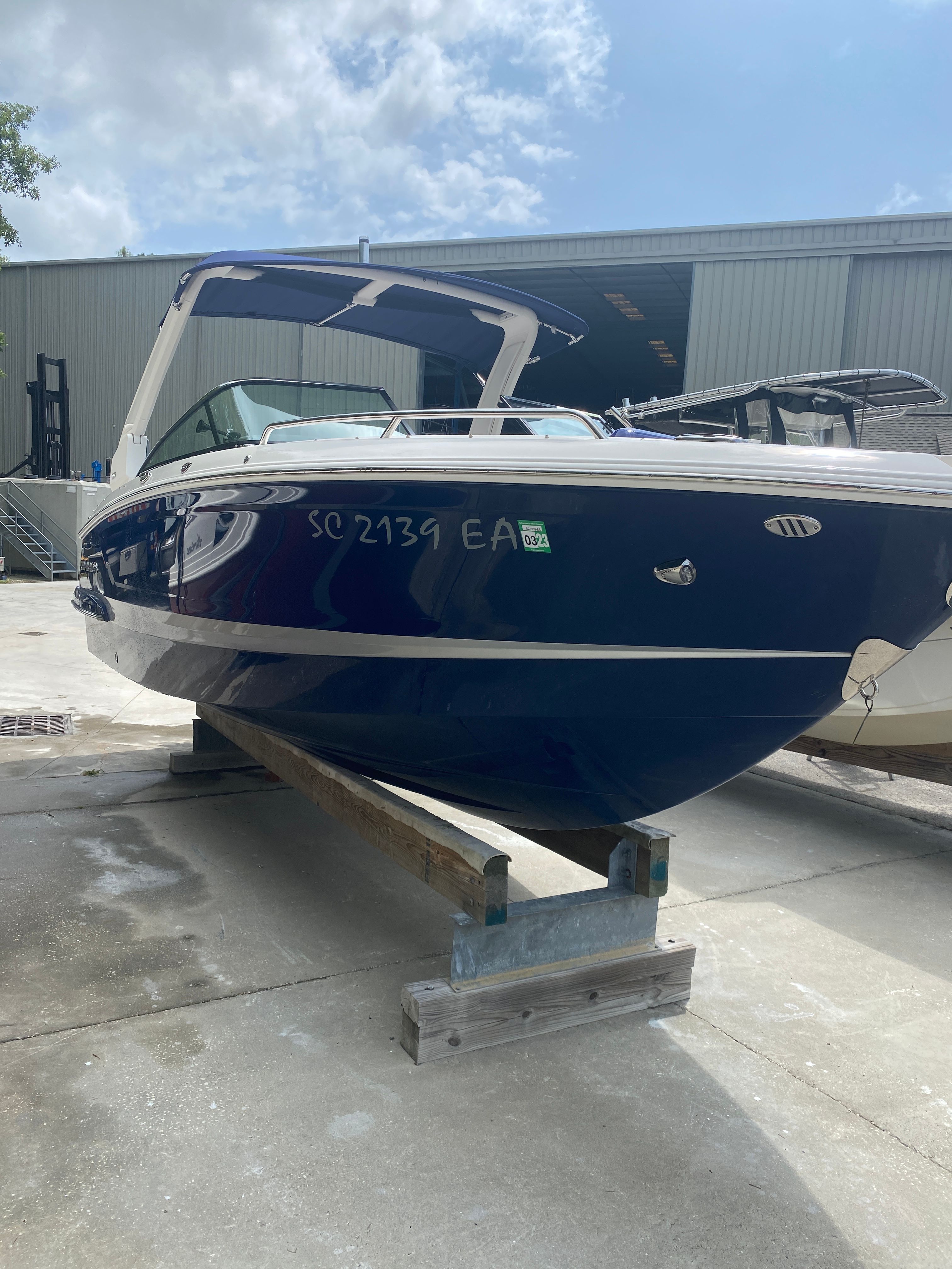 2020 Chaparral 256 SSX boat on a dock.