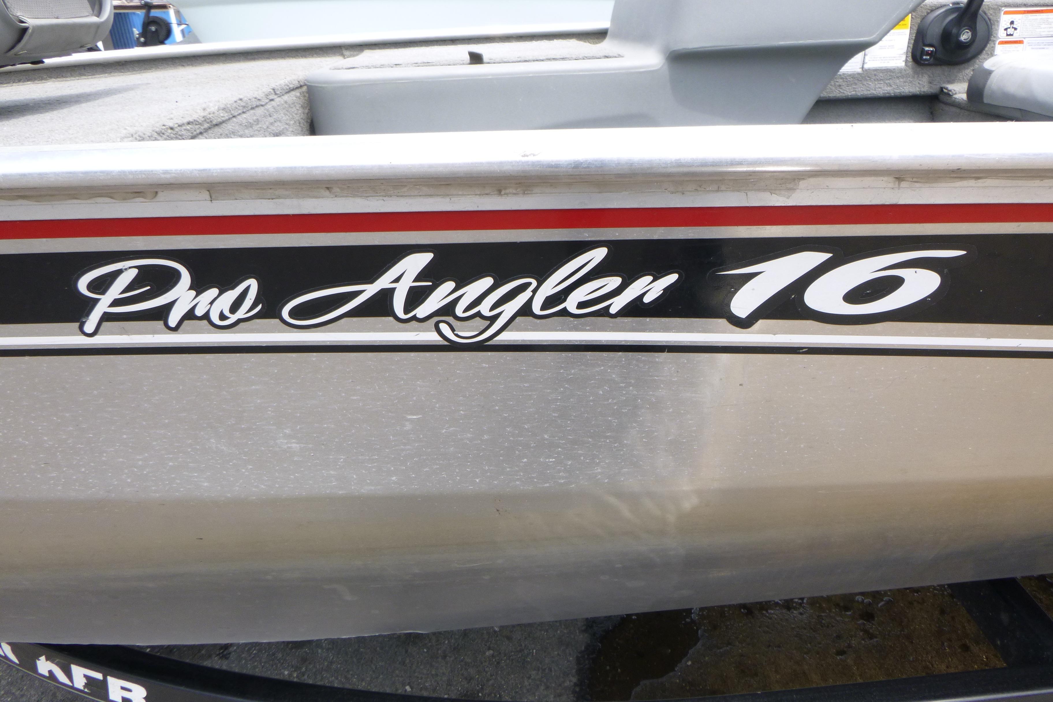 2011 Tracker Pro Angler 16 boat with sleek black and red detailing.