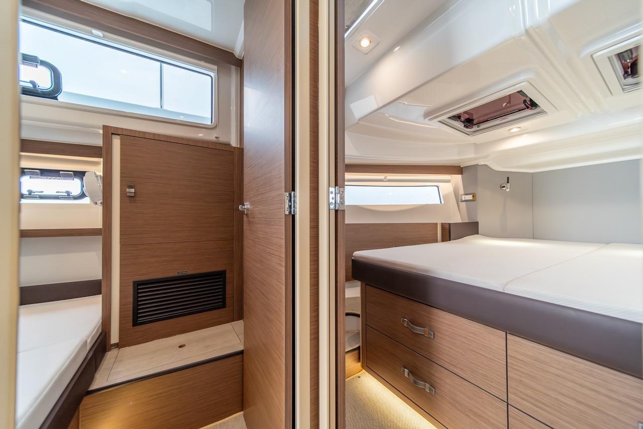 Luxurious interior of 2025 Delphia D11 SEDAN yacht with modern wood finishes.