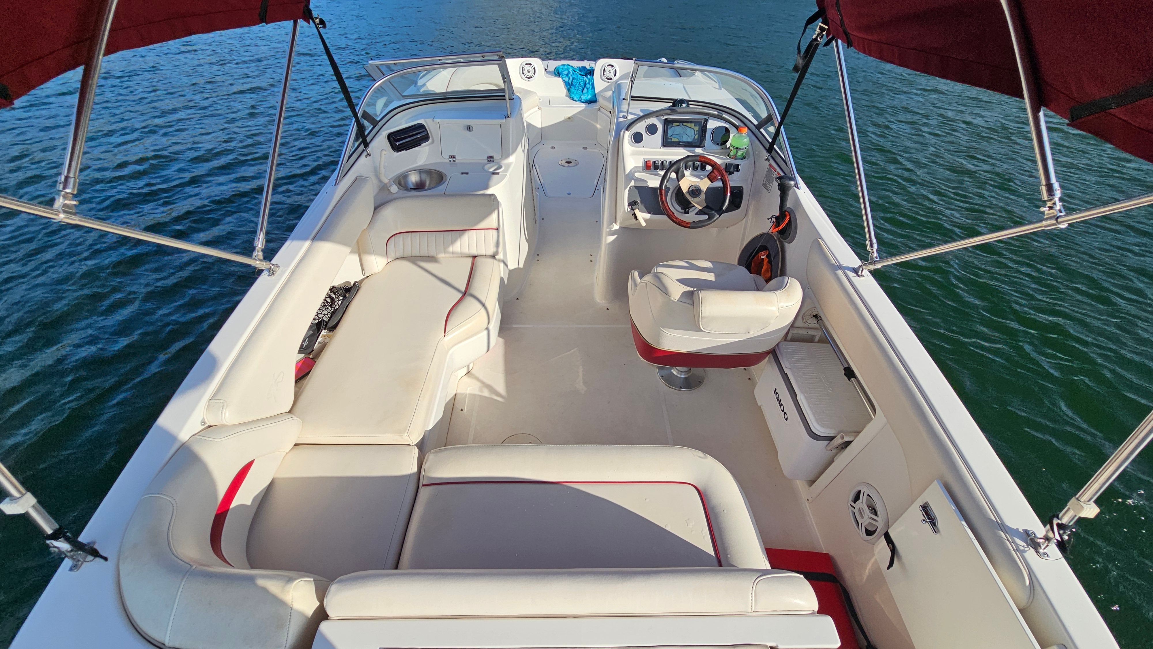 The image shows the cockpit of a 2002 Monterey 220 Explorer Sport boat on the water.