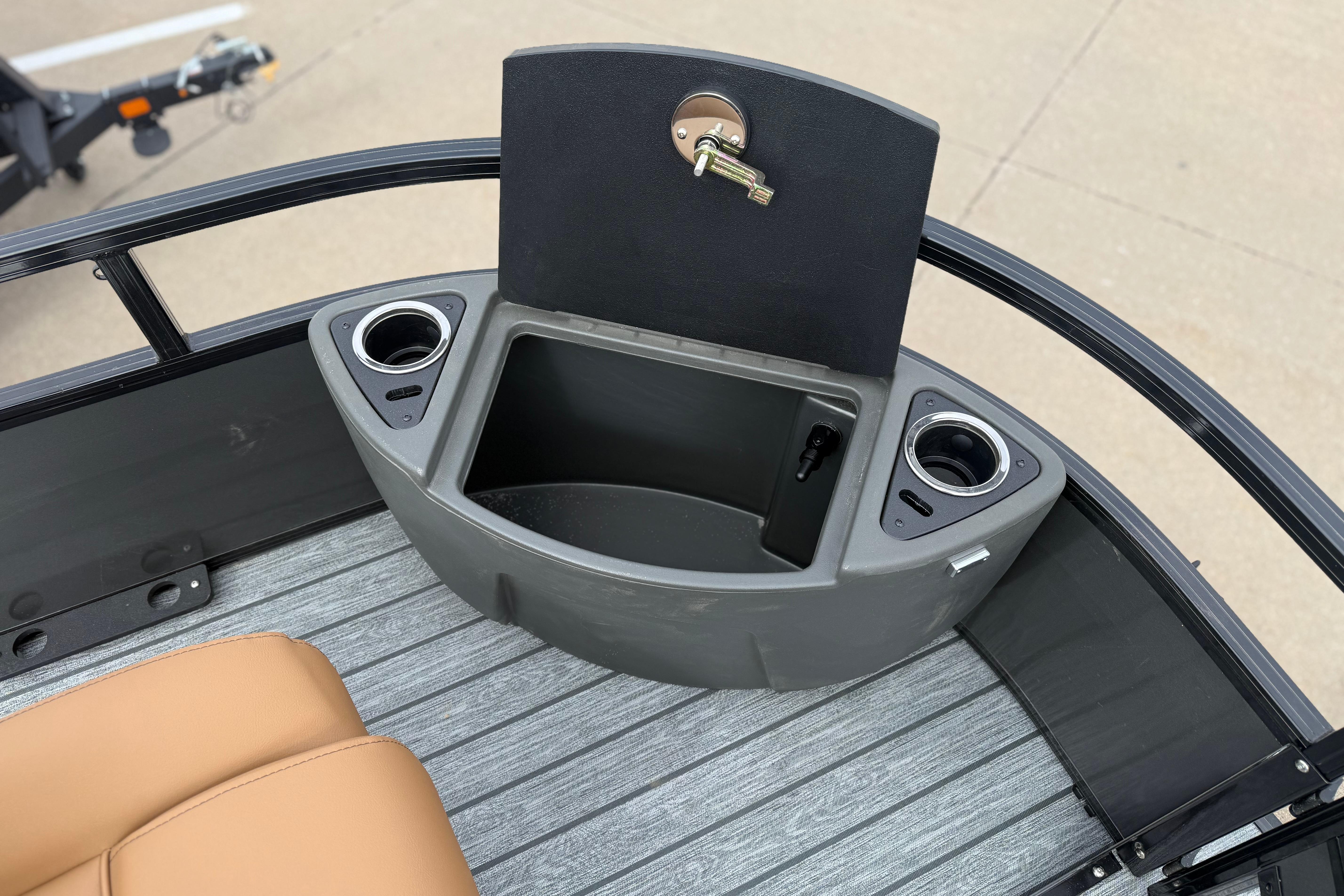 2026 Ranger 220F boat interior with cup holders and storage compartment.