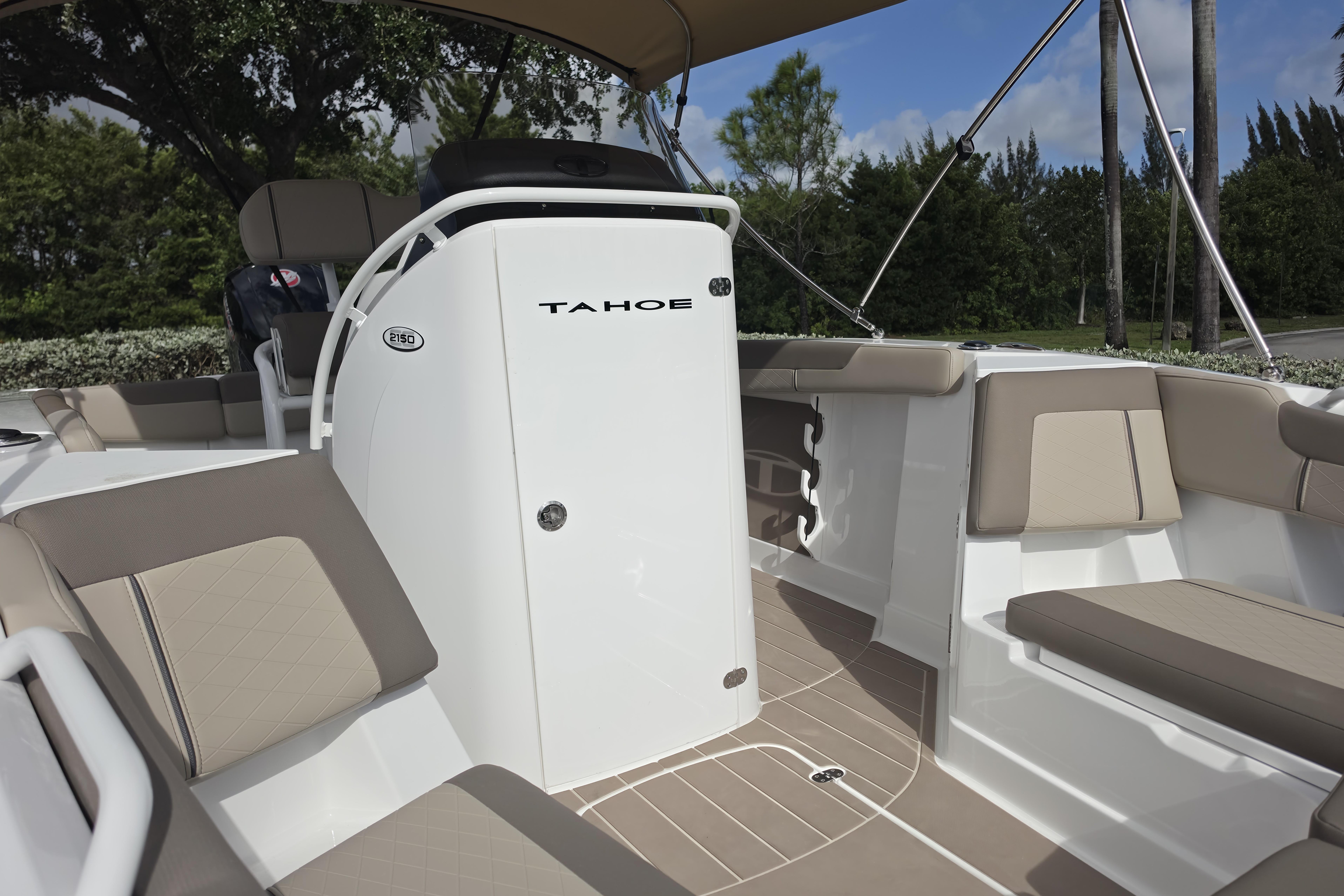2026 Tahoe 2150 CC boat interior with beige seating and sleek design.