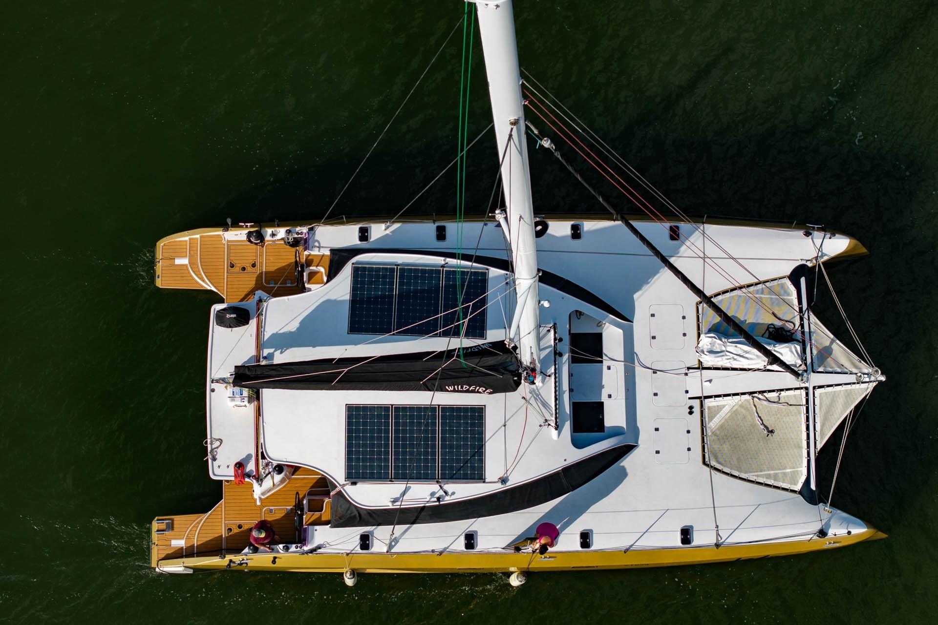 Aerial view of 2019 Schionning G Force 17C catamaran with solar panels on deck.