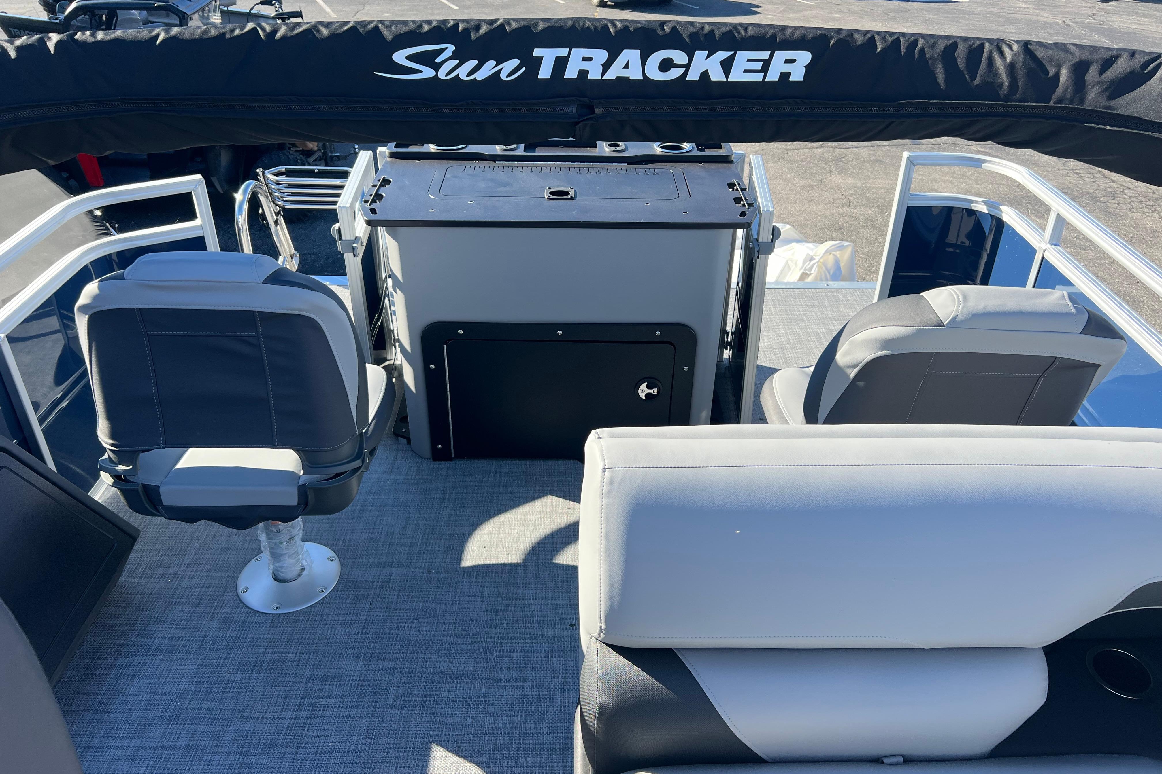 Interior view of 2026 Sun Tracker Sportfish 24 XP3 pontoon boat seating and helm.
