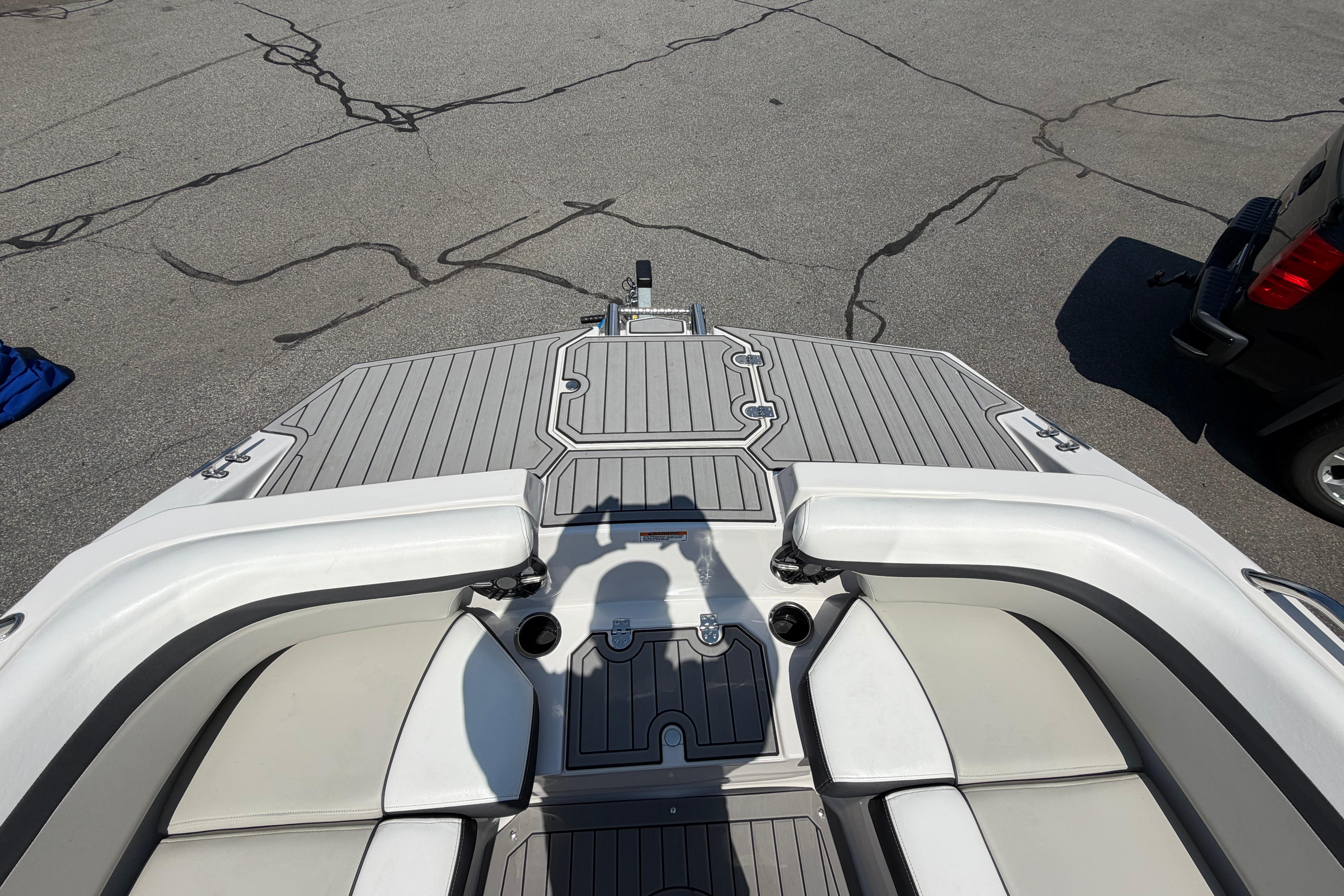 2025 Starcraft SVX 190 OB boat interior with gray decking and white seating.