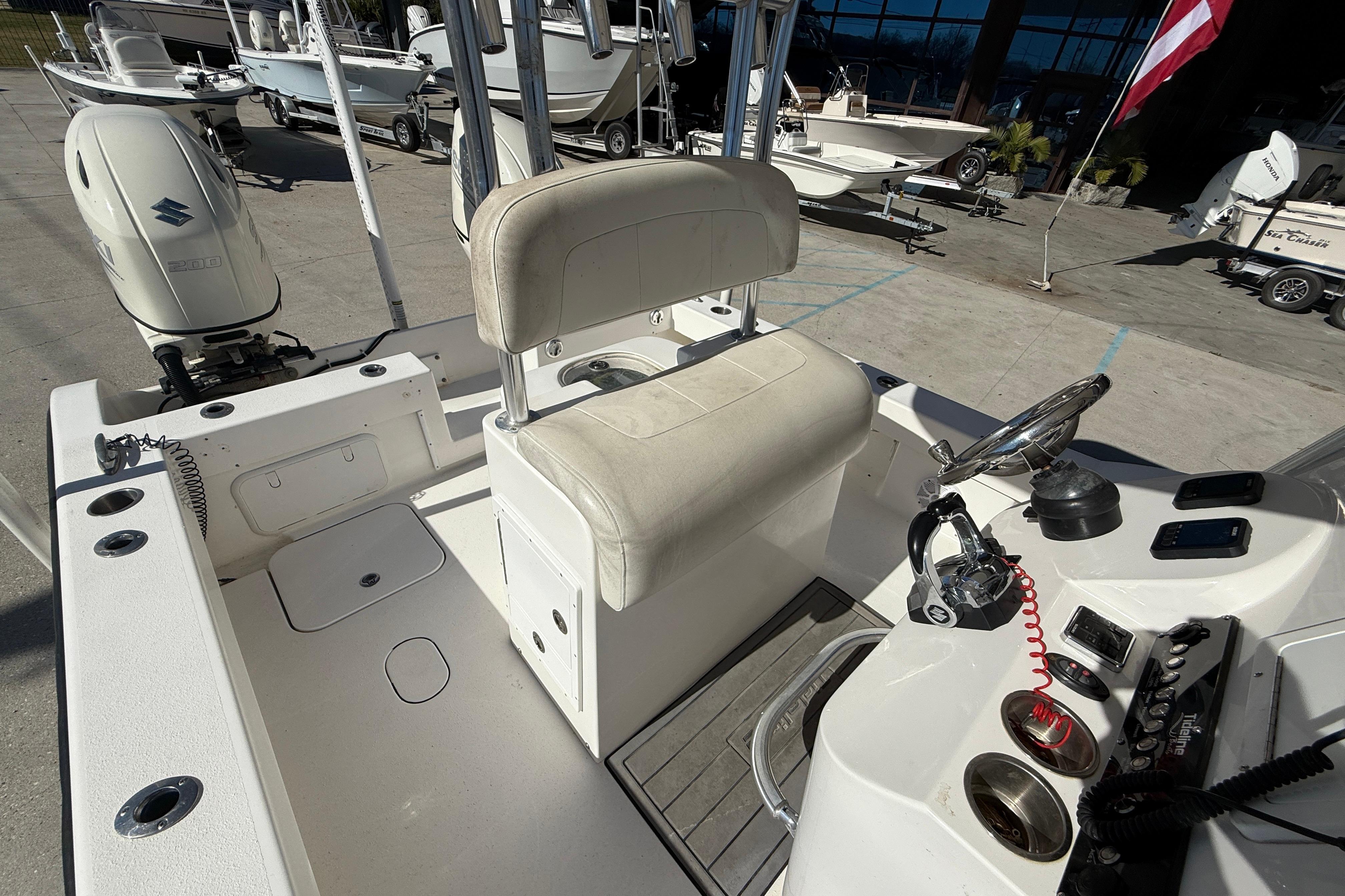2020 Tideline 235 Hybrid boat interior with steering console and seating.