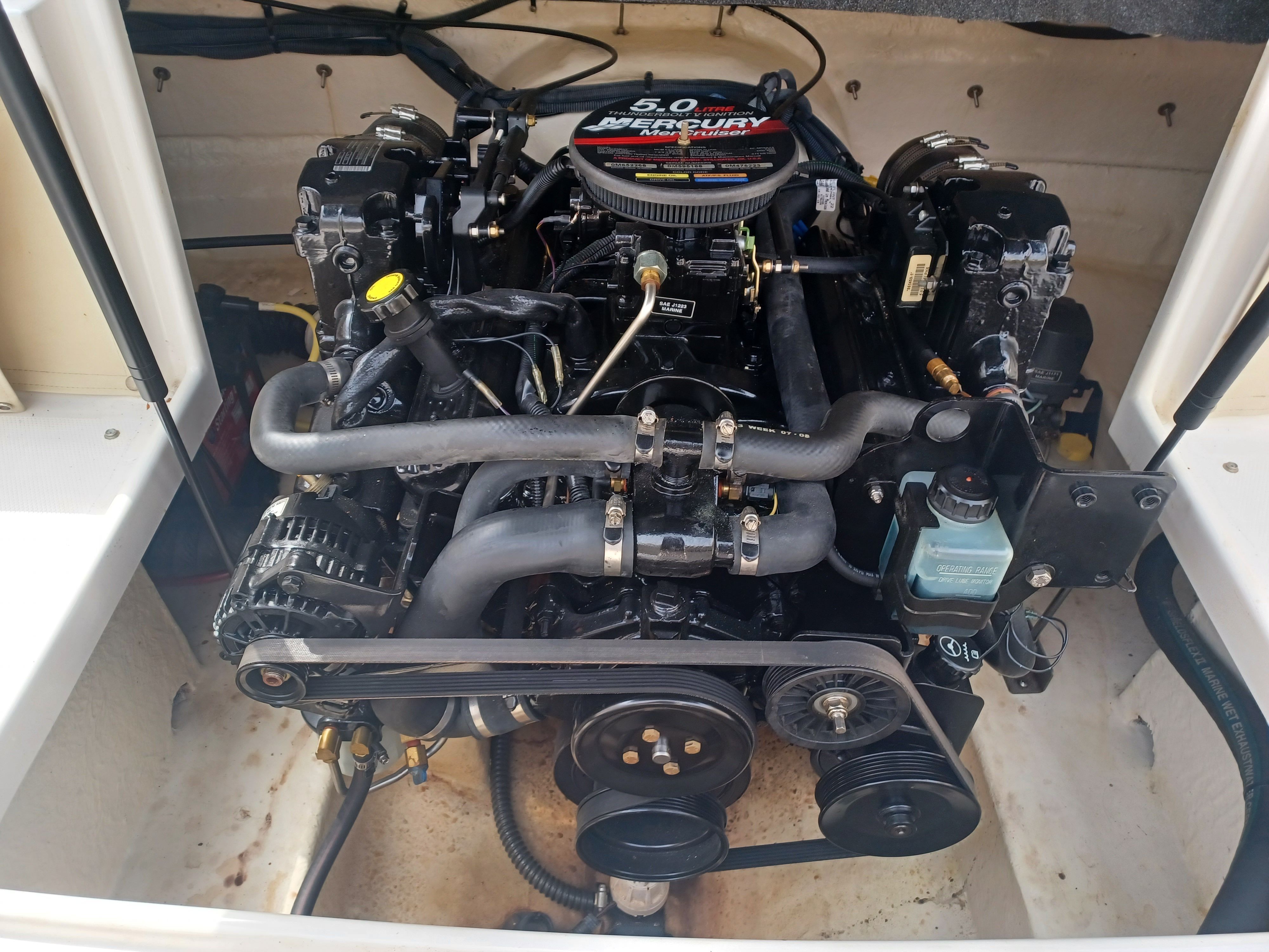A 5.0-liter engine in a 2004 Chaparral 215 SSi boat, clearly visible in the engine compartment.