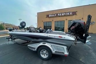 2026 Ranger Z518 Cup-Equipped boat parked outside a boat service center.
