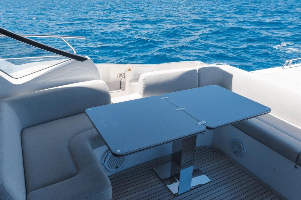 Luxurious seating area on 2020 Azimut 60 yacht with ocean view.