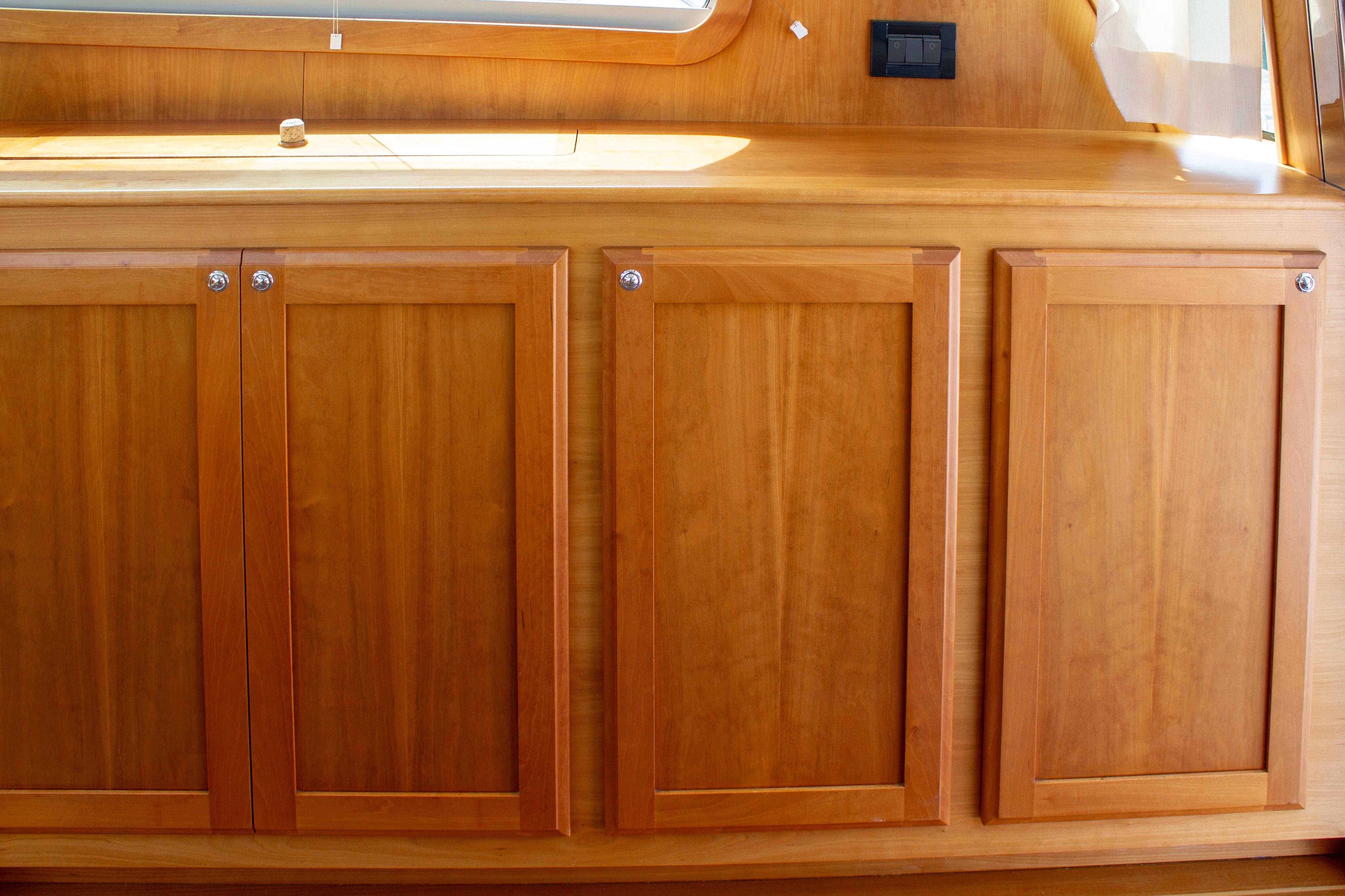 Wooden cabinetry inside 2013 Sabre 38 Salon Express yacht, featuring sleek design and polished finish.