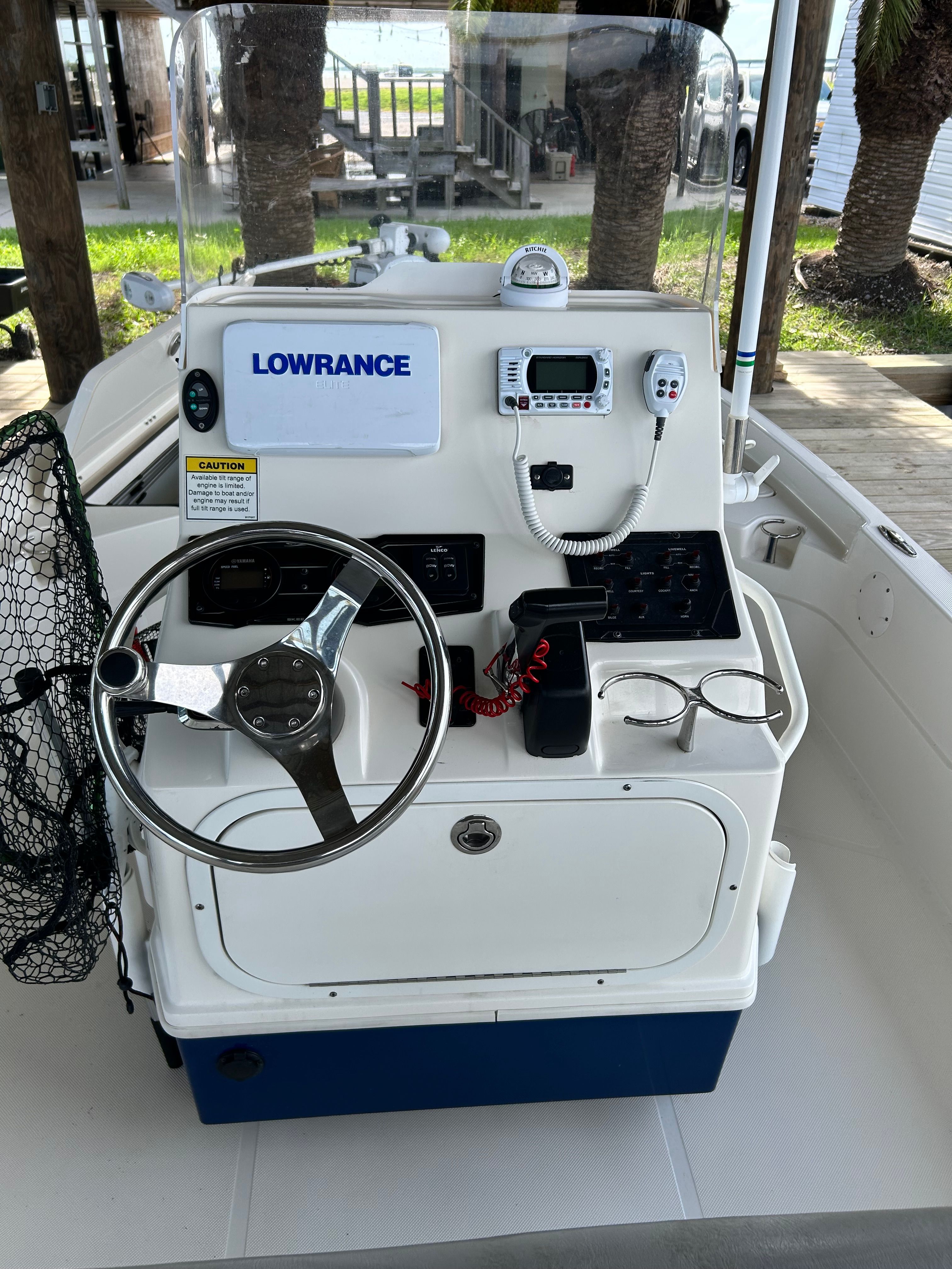 The image shows the helm of a 2016 Skeeter SX230 boat with navigation equipment.