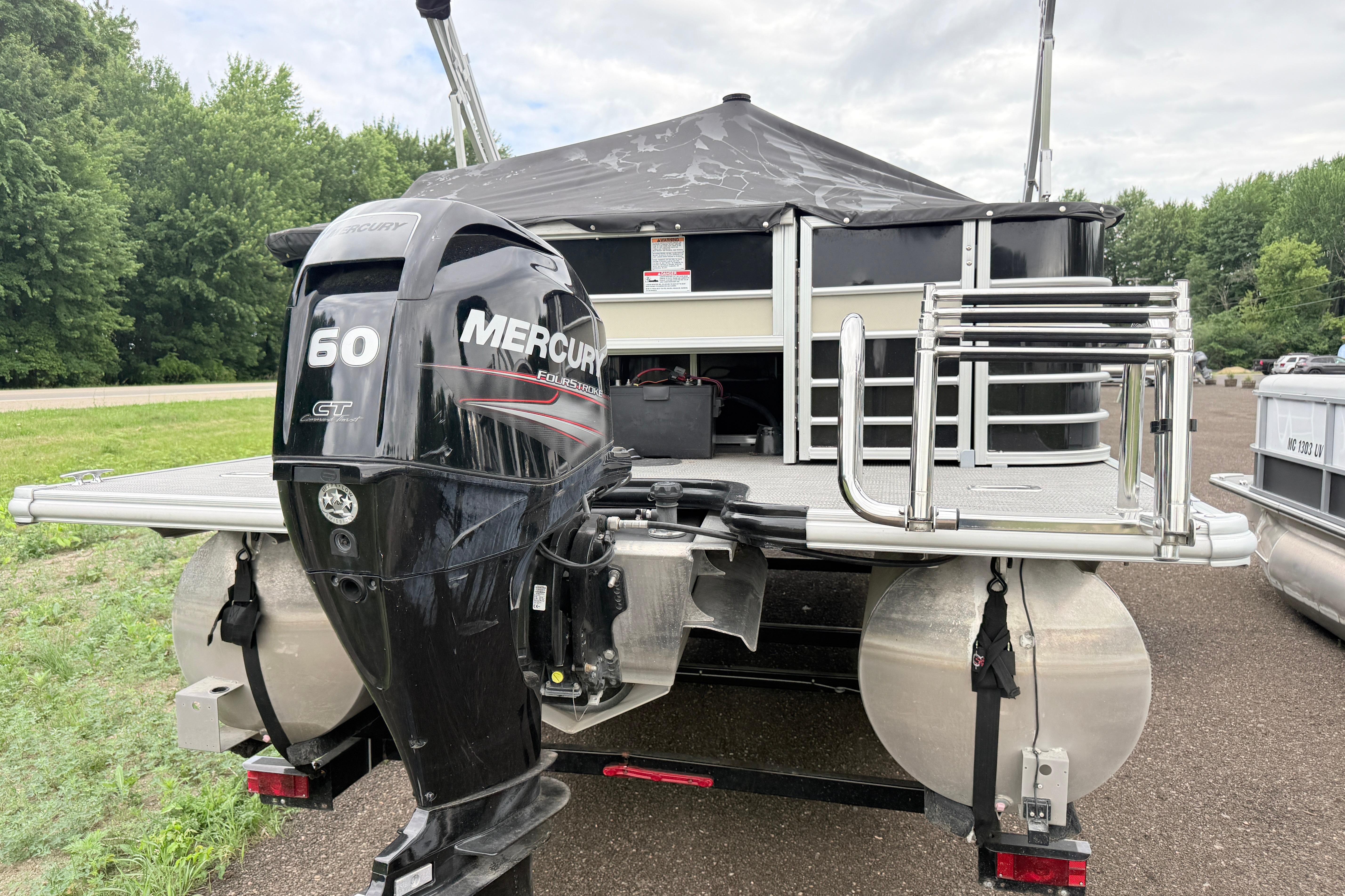 2019 Sylvan 8522 Mirage Signature pontoon boat with Mercury 60 HP outboard motor.