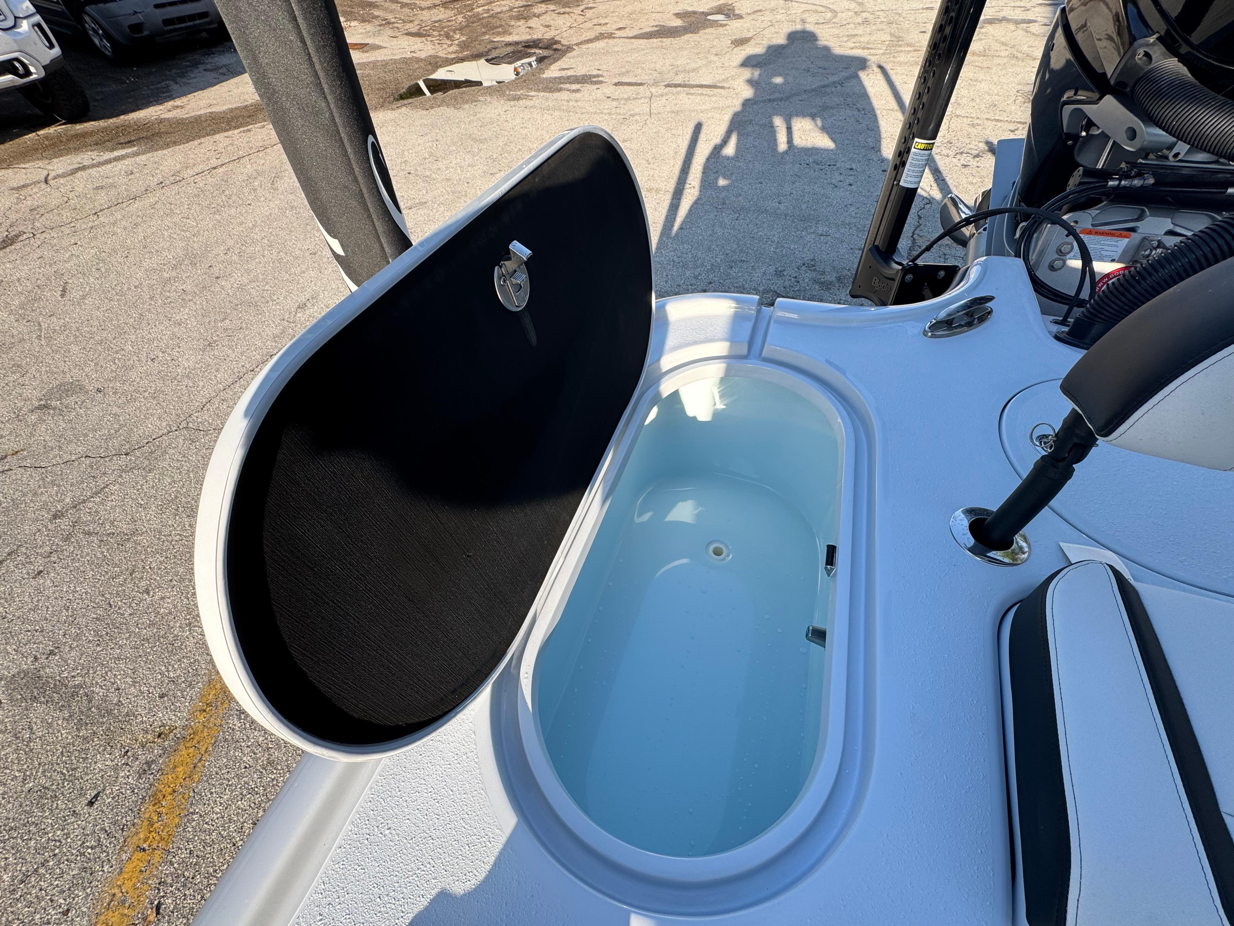 2025 Yellowfin 24 CE boat with open storage compartment on deck.
