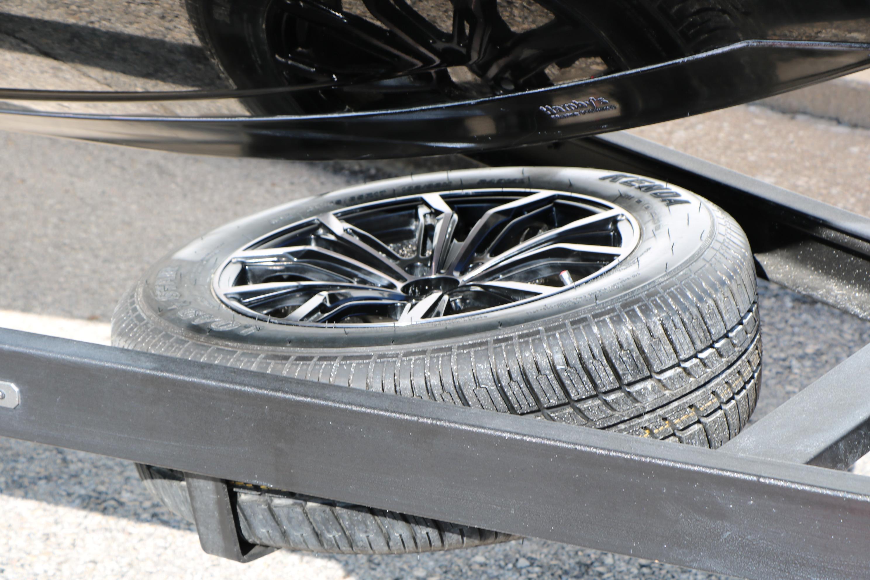 2022 Vexus VX21 trailer with a sleek black spare tire and alloy wheel.