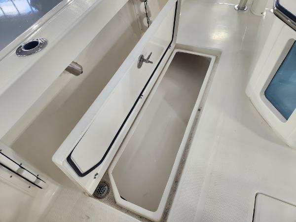Open storage compartment on 2025 Pathfinder 2400 Open boat deck.