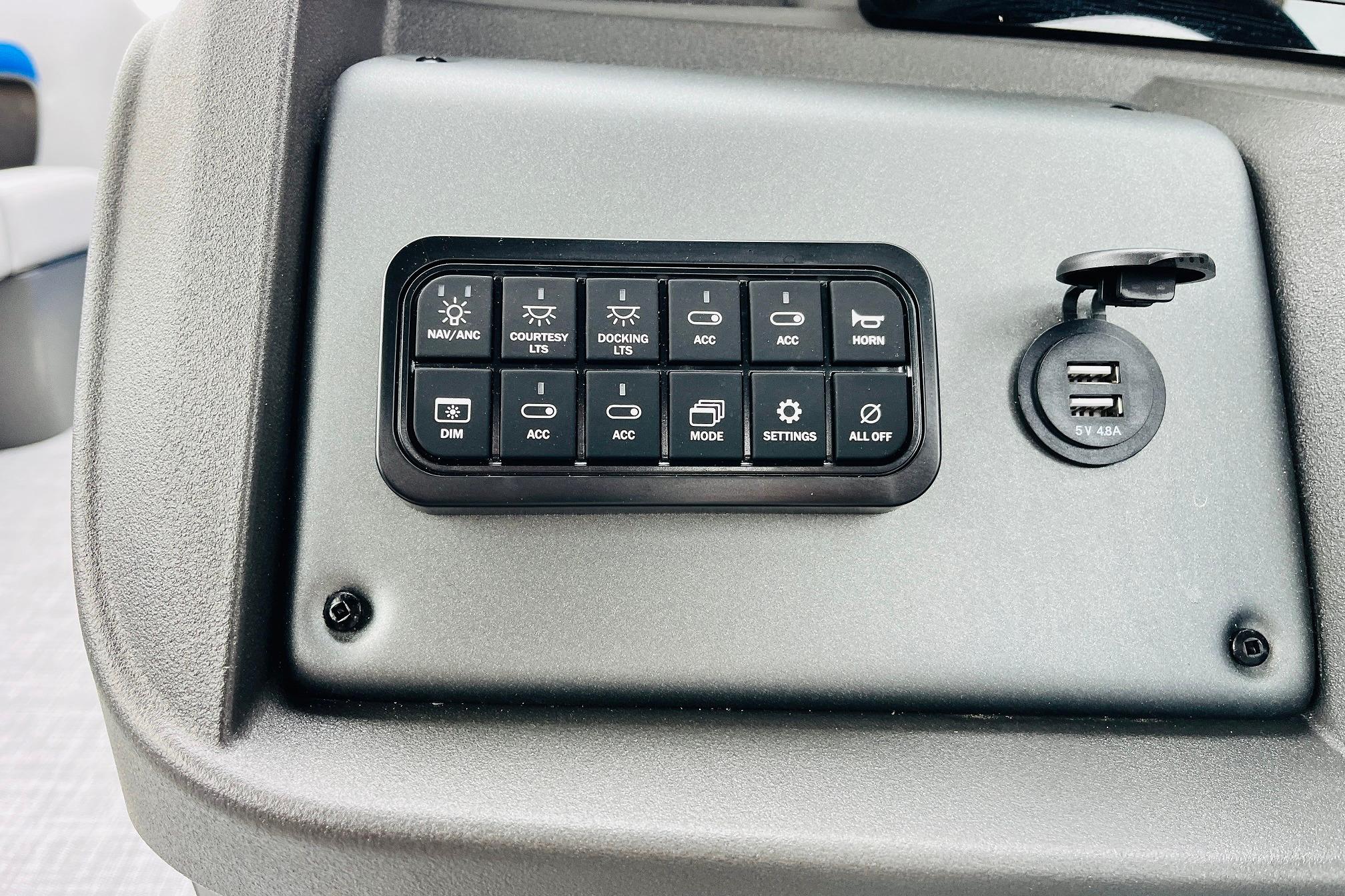 Control panel of 2026 Sun Tracker Party Barge 22 RF DLX with USB ports.