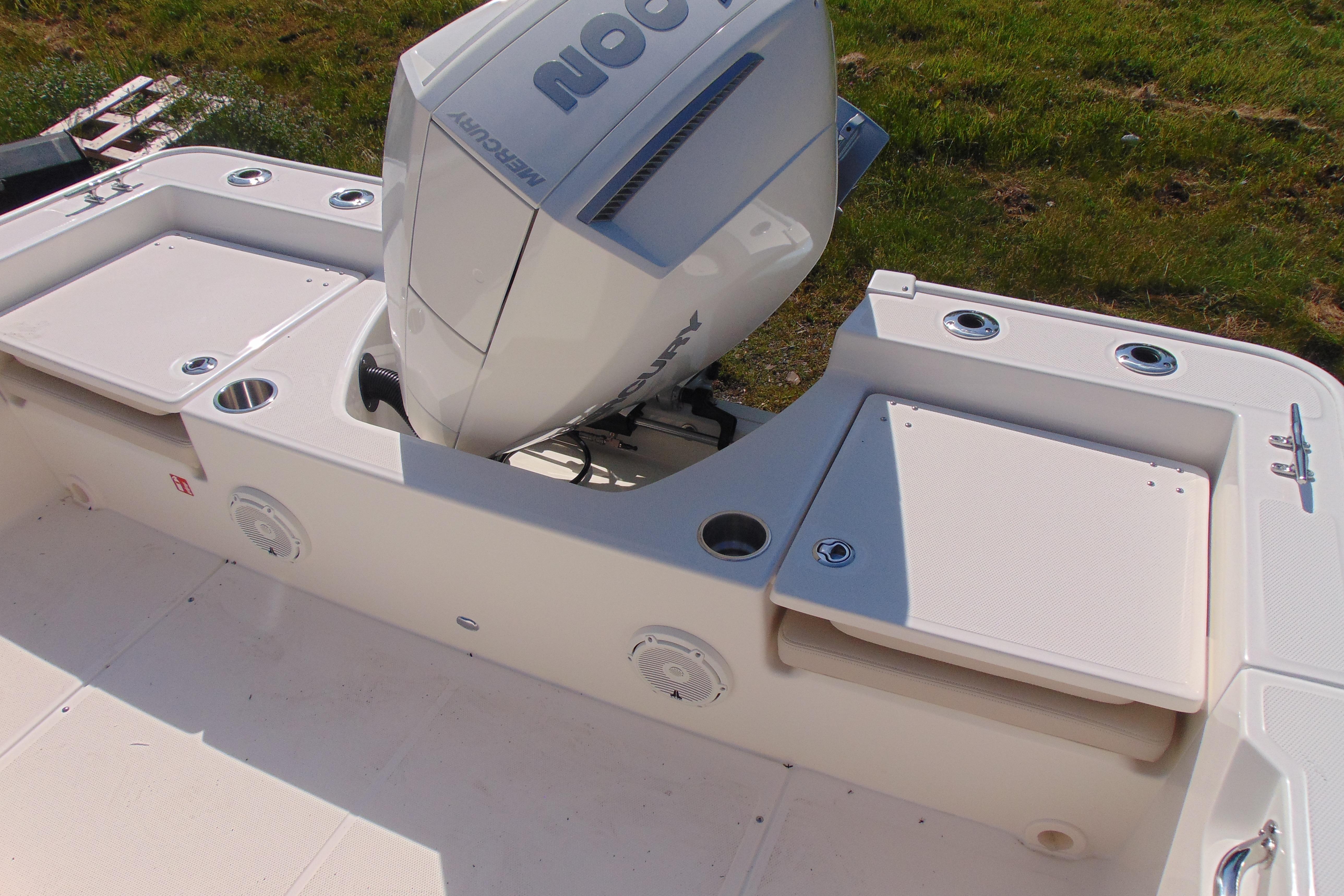 2026 Boston Whaler 210 Montauk boat with Mercury engine, featuring spacious deck and storage compartments.