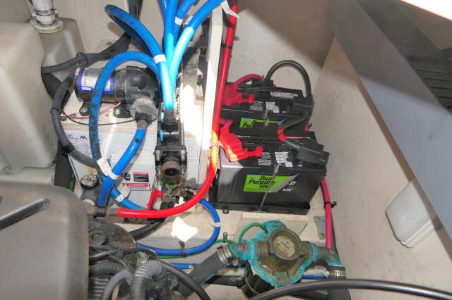 Engine compartment of 2005 Sea Ray 340 Sundancer with batteries and wiring.
