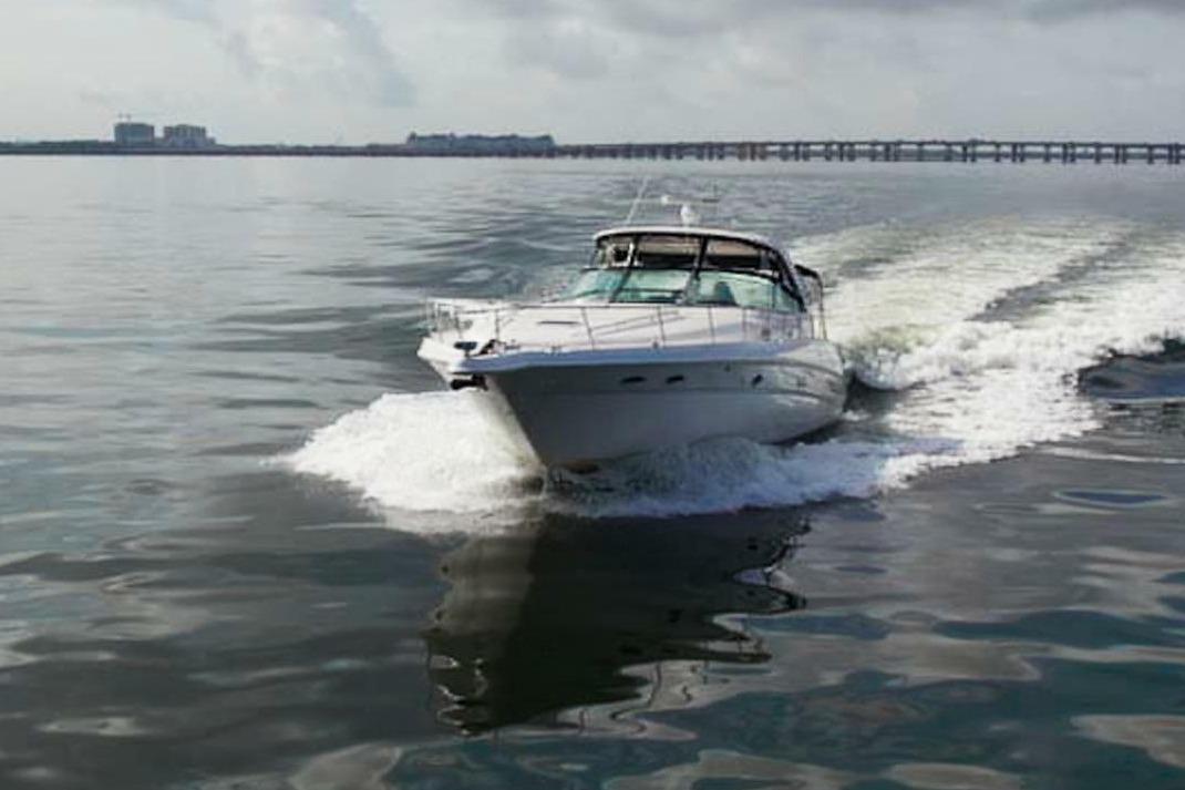 2003 Sea Ray Sundancer 460 cruising on calm waters.