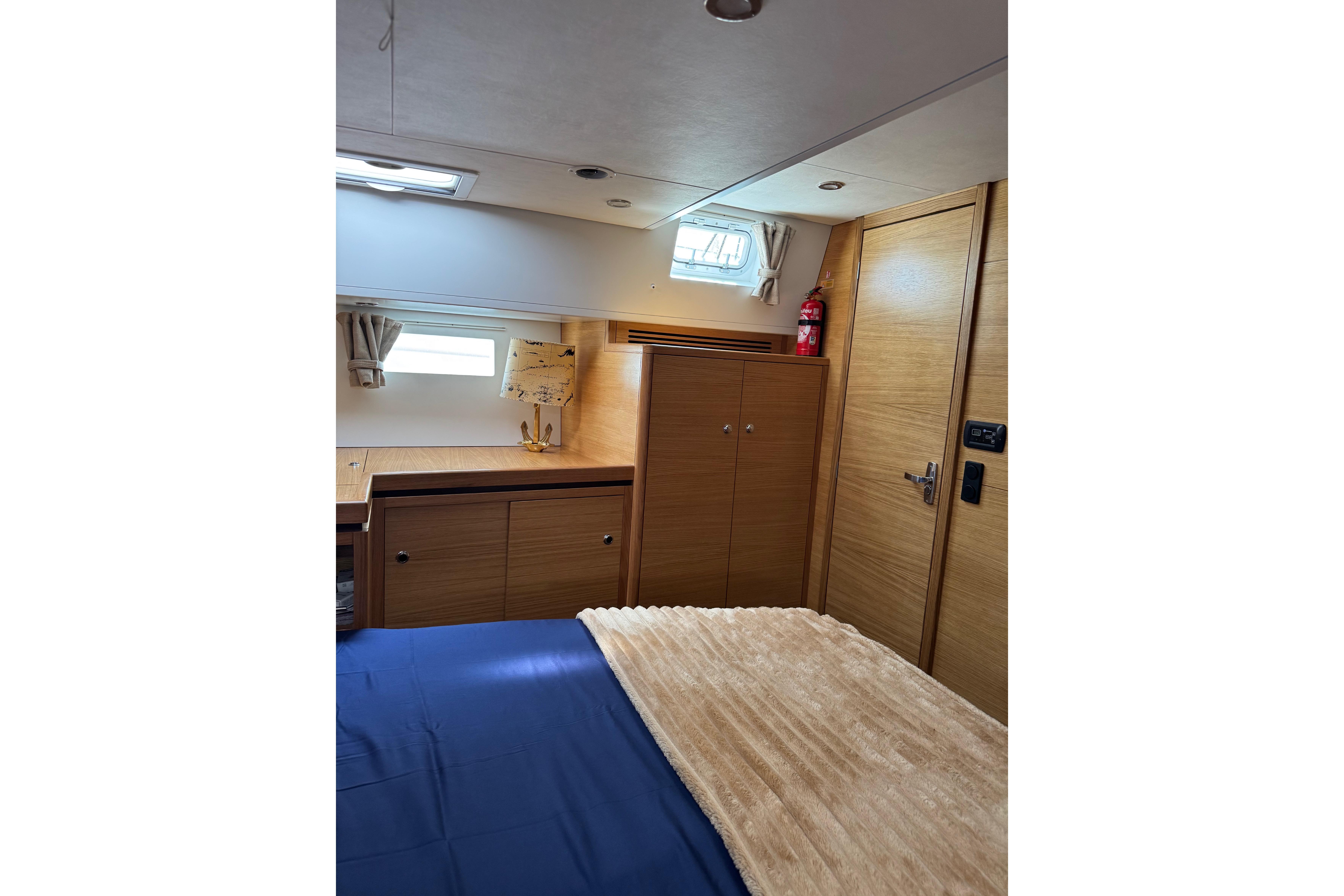 Cozy interior cabin of 2023 Garcia SLOOP ALUMINIUM 51 yacht with wooden furnishings.