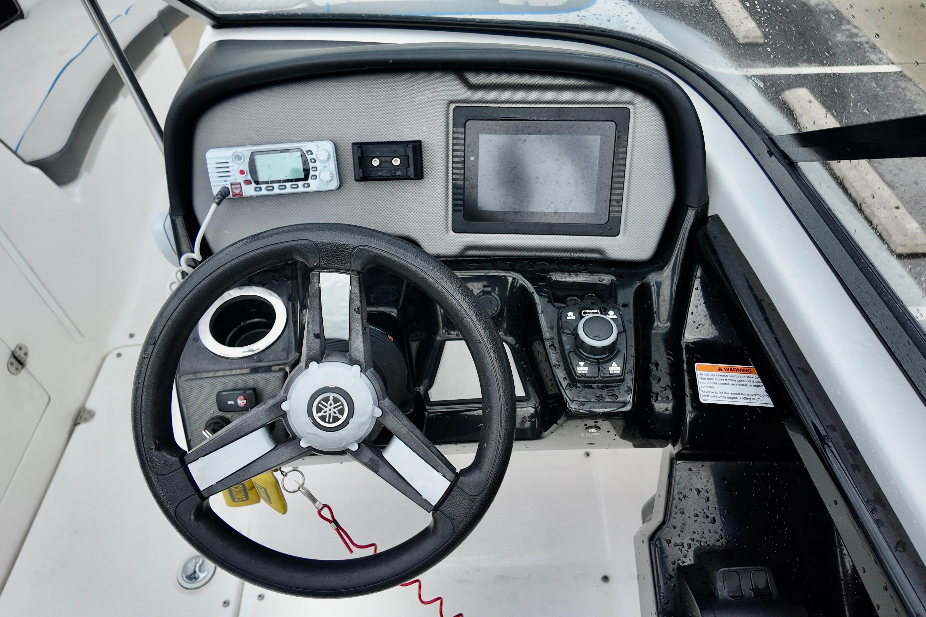 2020 Yamaha Boats AR240 dashboard with steering wheel, control panel, and navigation display.