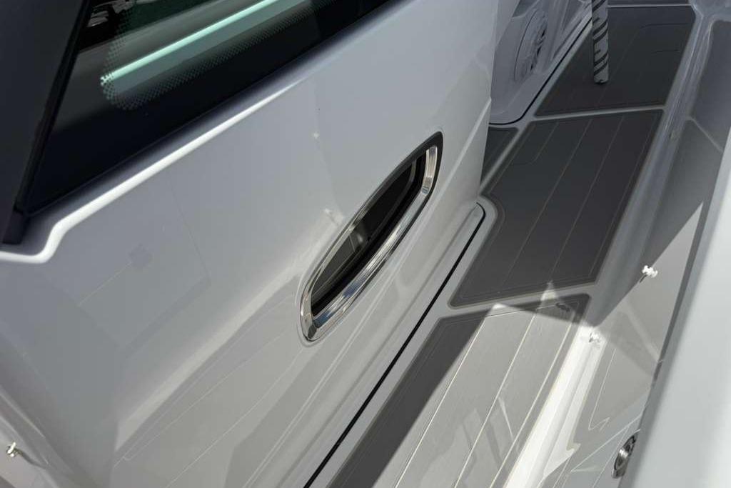 2026 Monterey Elite 30 OB boat deck with sleek design and modern detailing.