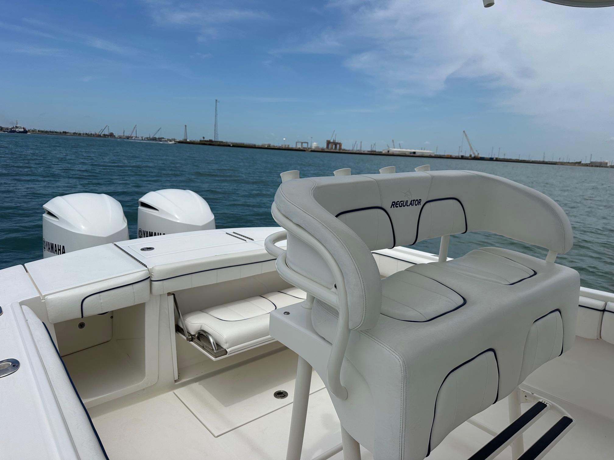 2016 Regulator center console boat with Yamaha engines on open water.