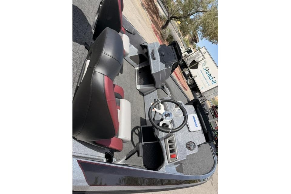 Interior of a 2026 Nitro Z18 boat with steering wheel and dashboard.