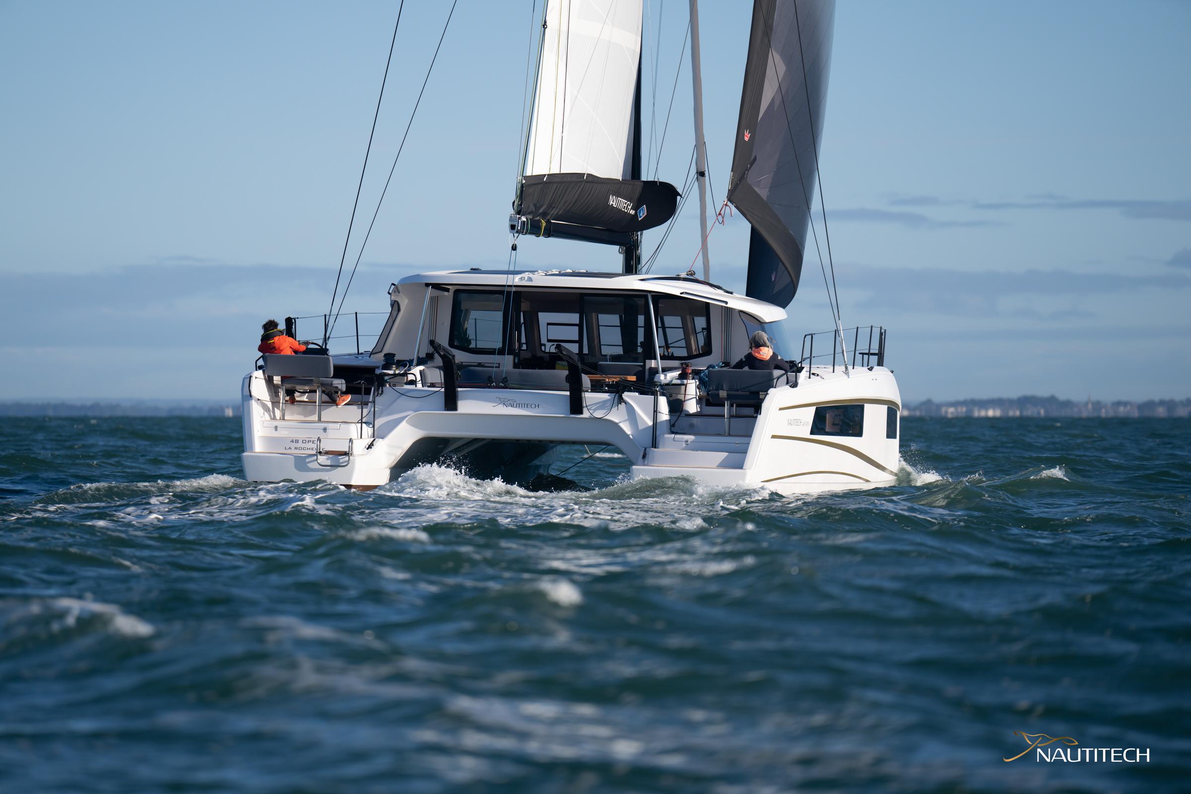 2025 Nautitech 48 Open catamaran sailing on open sea.