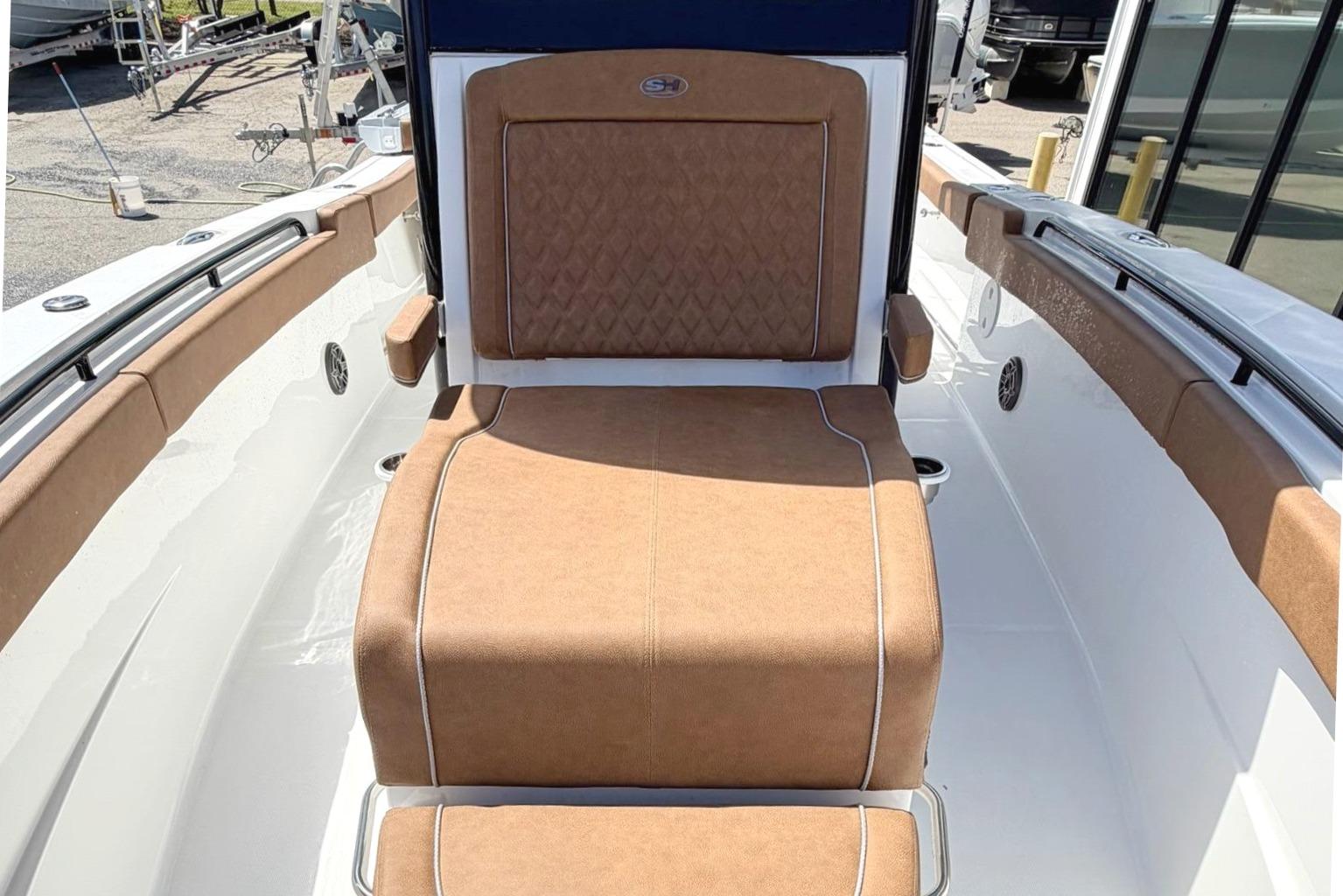 2026 Sea Hunt Ultra 305 Coffin Box with brown upholstery.