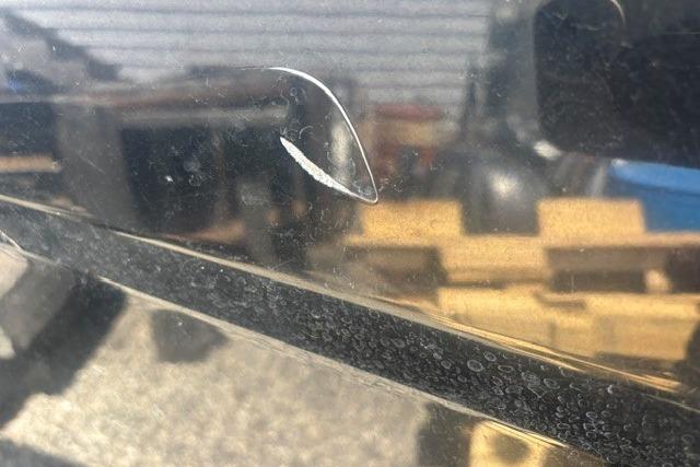 Close-up of a scratch on a 2021 Chaparral 21 SSi boat hull.