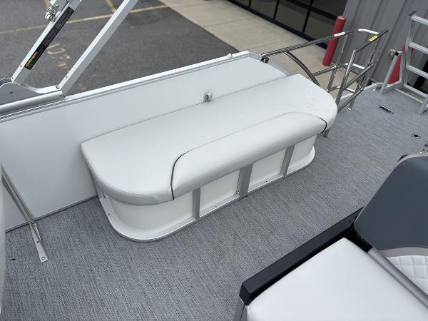 2025 Godfrey SWEETWATER 2286 SFL boat interior with white cushioned seating.