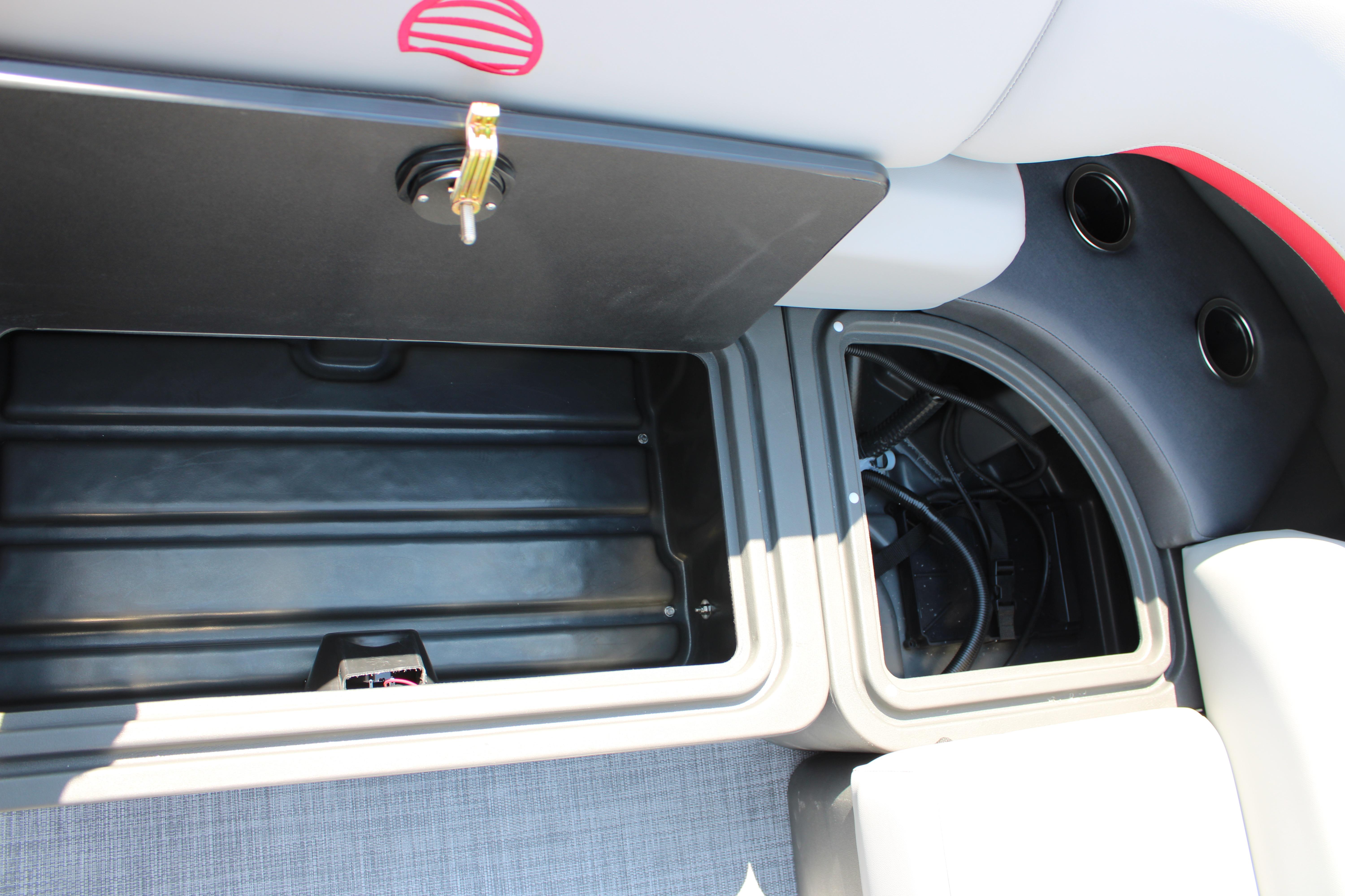 Storage compartments on a 2026 Sun Tracker Party Barge 20 DLX pontoon boat.