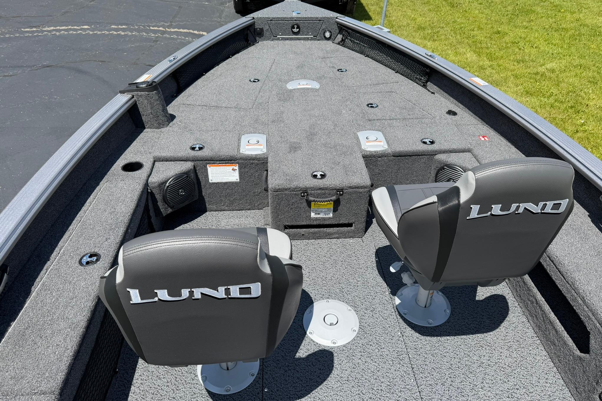 2027 Lund 1875 Pro Guide boat interior with two seats and carpeted deck.