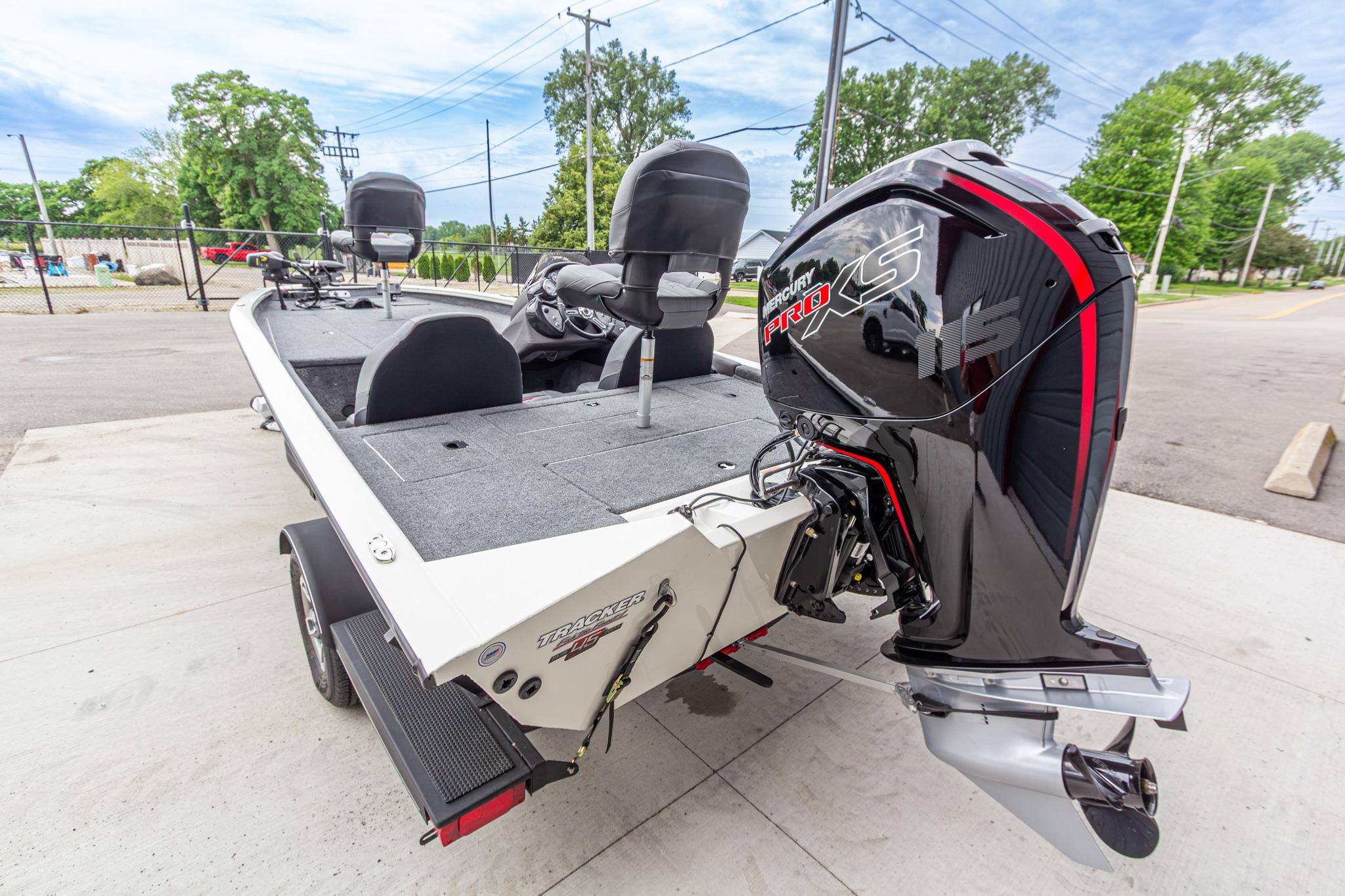 2023 Tracker Pro Team 190 TX boat with Mercury Pro XS engine, parked outdoors.