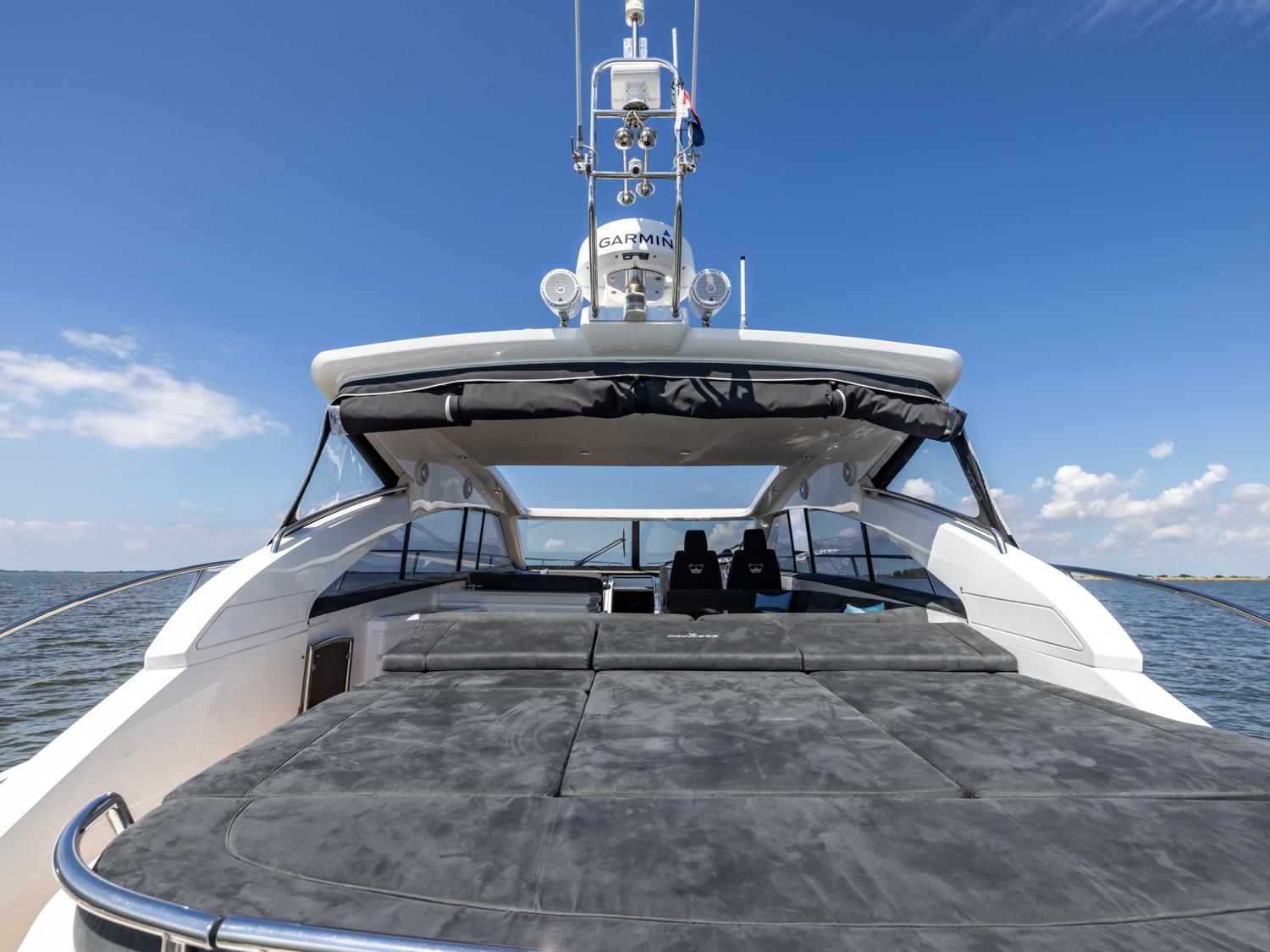 Luxury 2007 Princess V53 yacht with spacious deck under clear blue sky.
