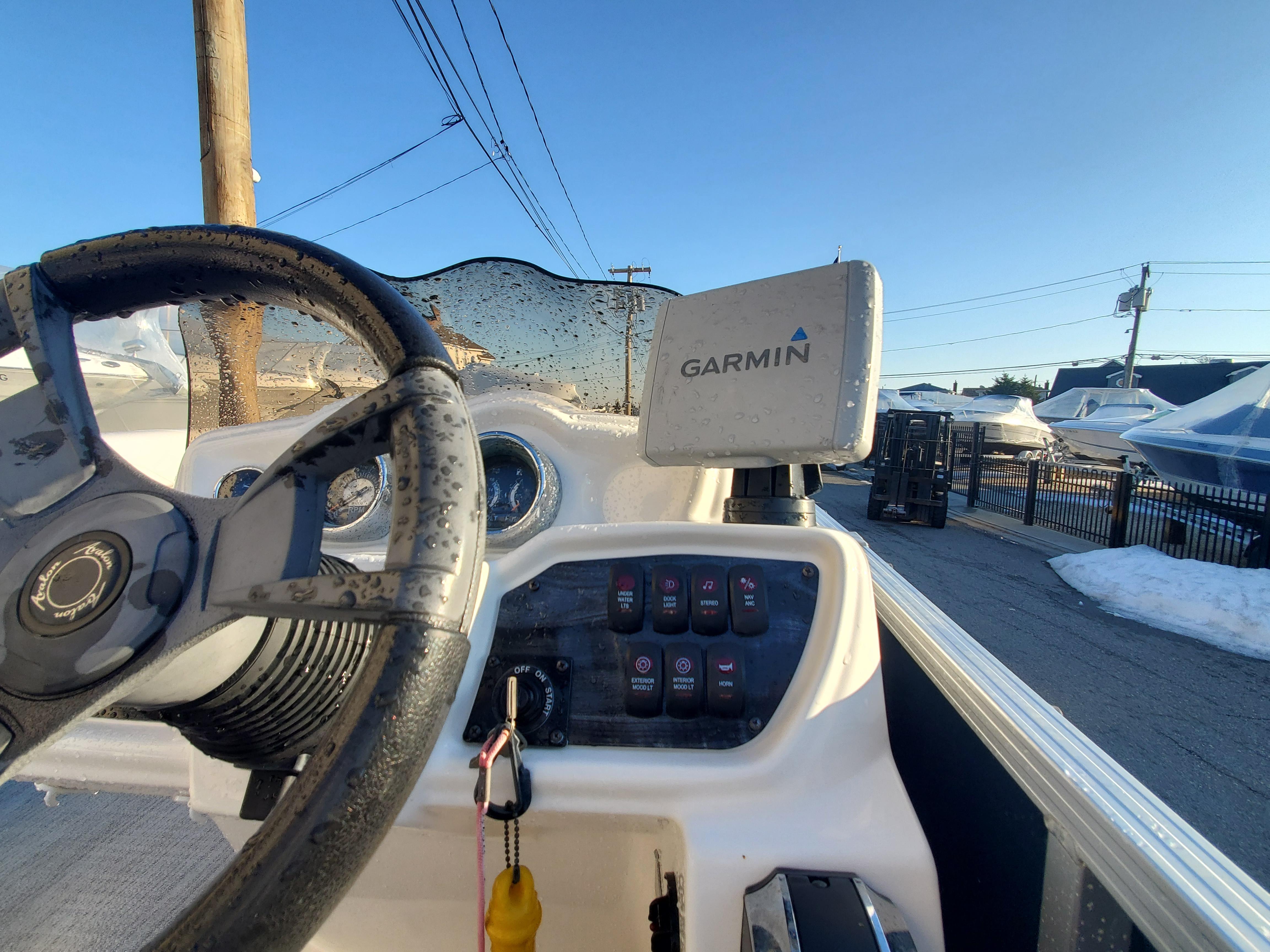 2017 Avalon LSZ Quad Lounger boat dashboard with Garmin navigation system.