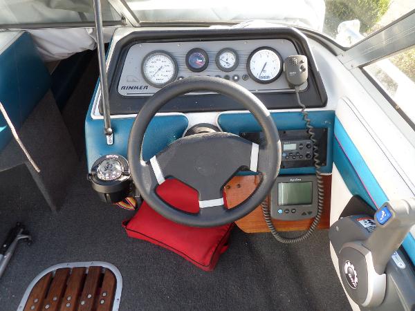 1992 Rinker Captiva 170 OB boat dashboard with steering wheel and gauges.